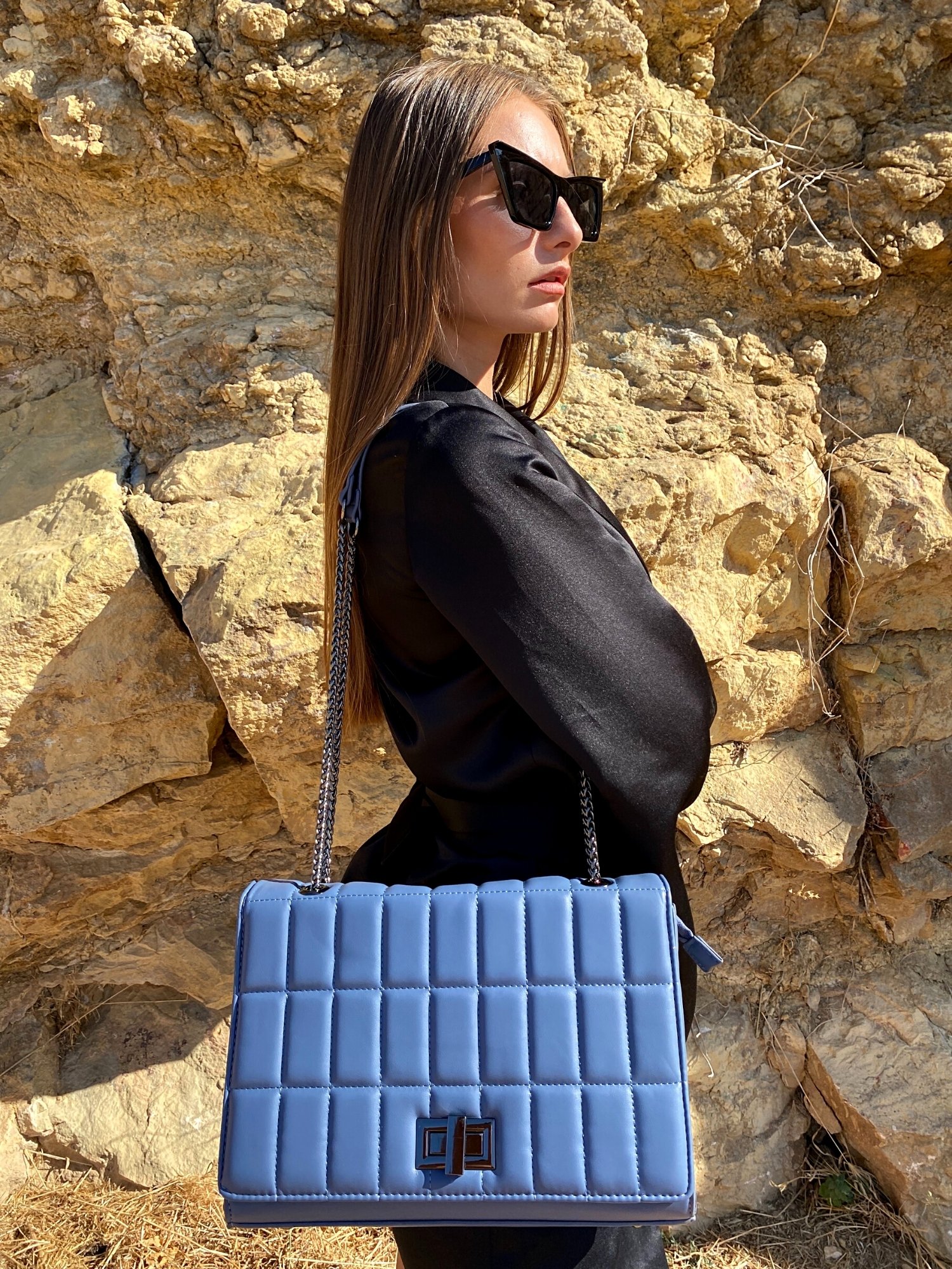 Quilted chain strap shoulder bag in green, pink, and blue colors with a stylish design and metal closure.