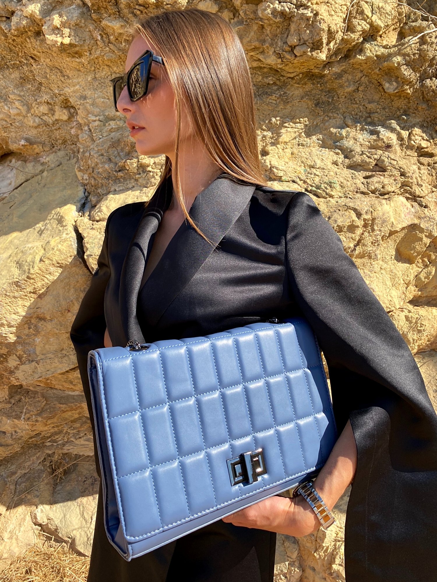 Quilted chain strap shoulder bag in green, pink, and blue colors with a stylish design and metal closure.