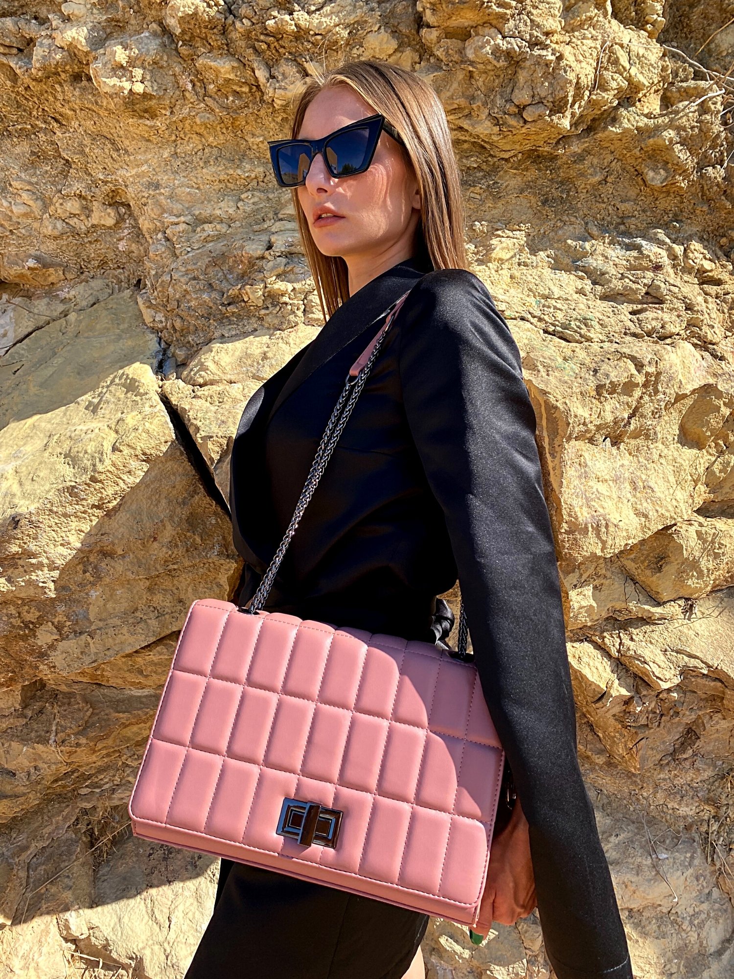 Quilted chain strap shoulder bag in green, pink, and blue colors with a stylish design and metal closure.