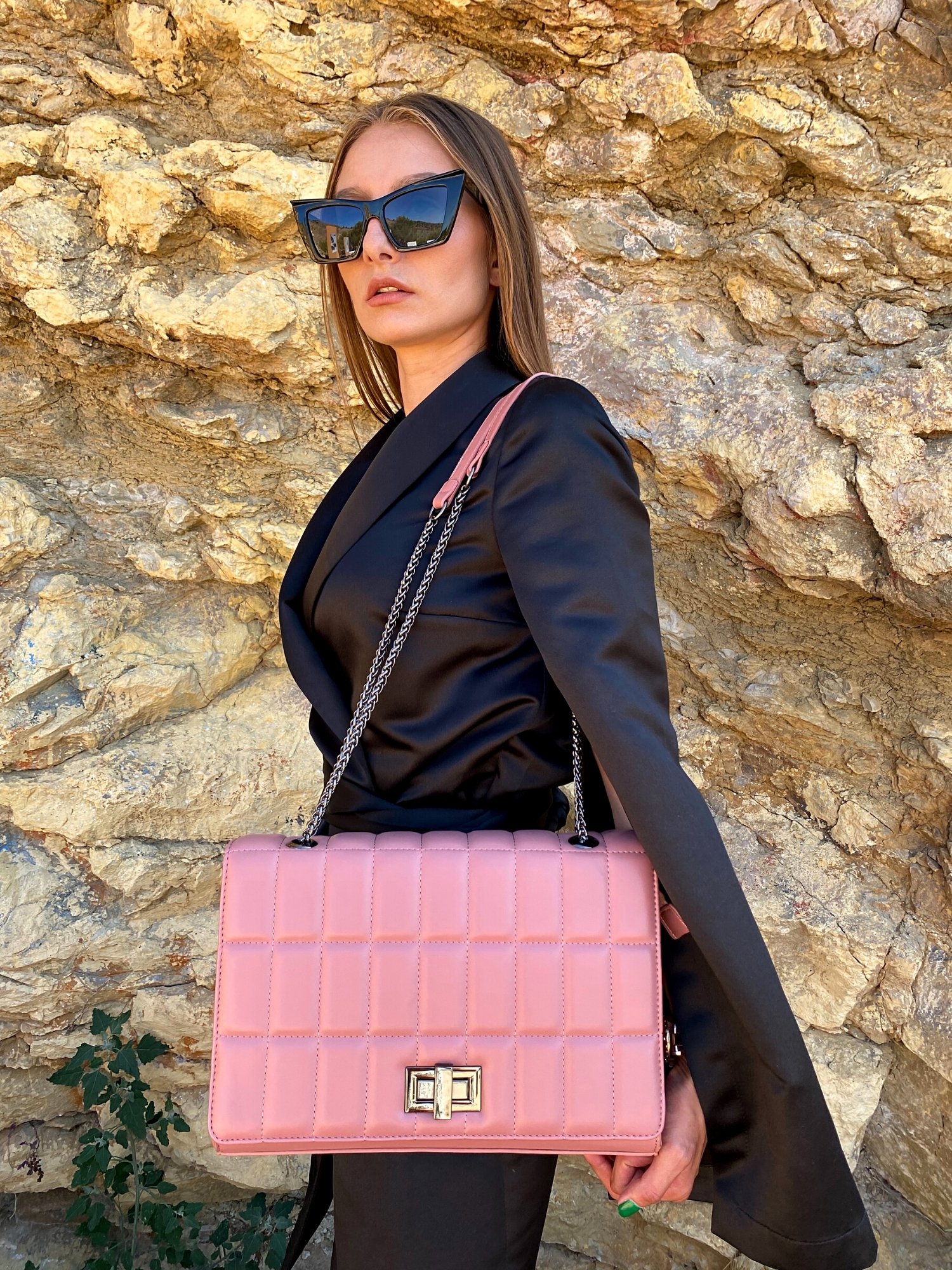 Quilted chain strap shoulder bag in green, pink, and blue colors with a stylish design and metal closure.