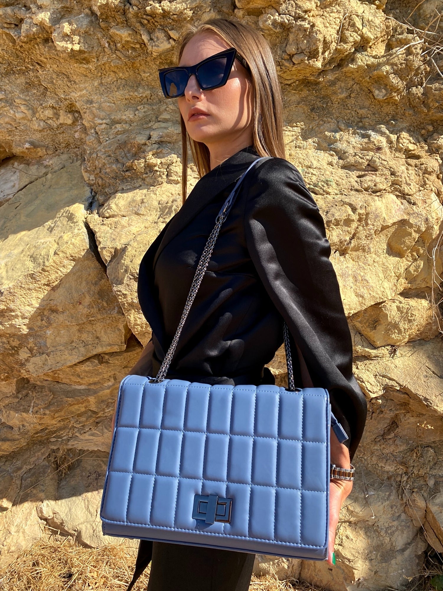 Quilted chain strap shoulder bag in green, pink, and blue colors with a stylish design and metal closure.