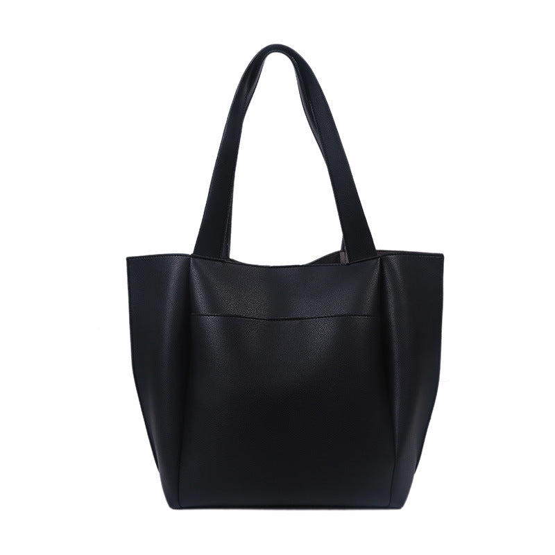 A stylish Retro PU Leather Hong Kong Style Handbag in a square shape, showcasing its chic design and durable material.