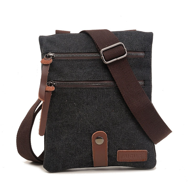 Retro style small messenger bag made of durable canvas, featuring a zipper closure and multiple internal pockets for organization.