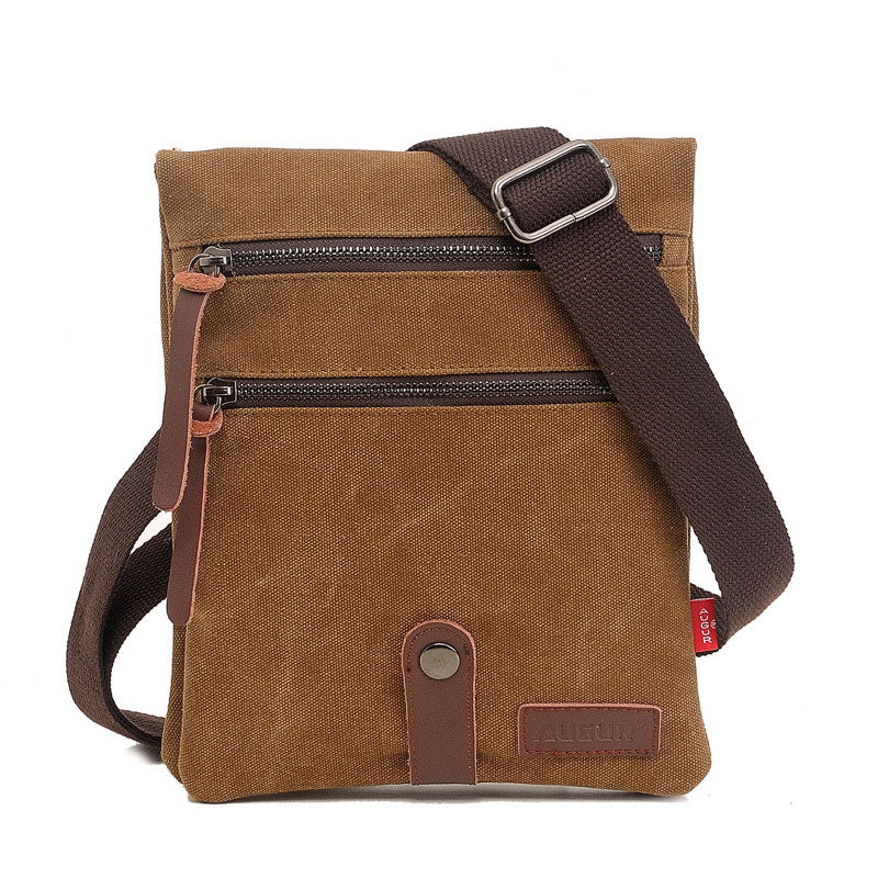 Retro style small messenger bag made of durable canvas, featuring a zipper closure and multiple internal pockets for organization.