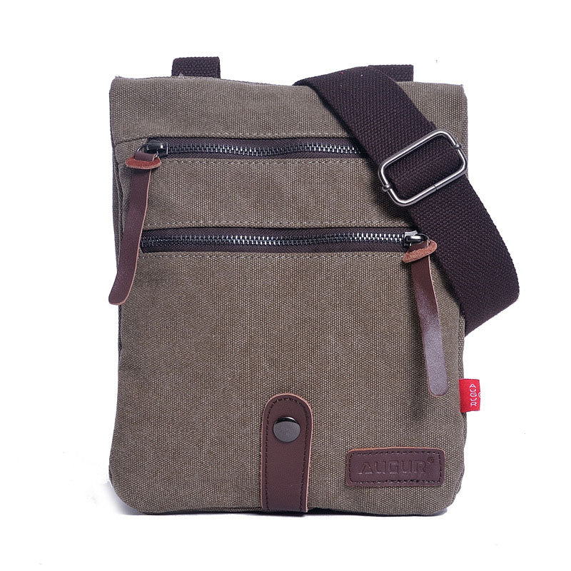 Retro style small messenger bag made of durable canvas, featuring a zipper closure and multiple internal pockets for organization.