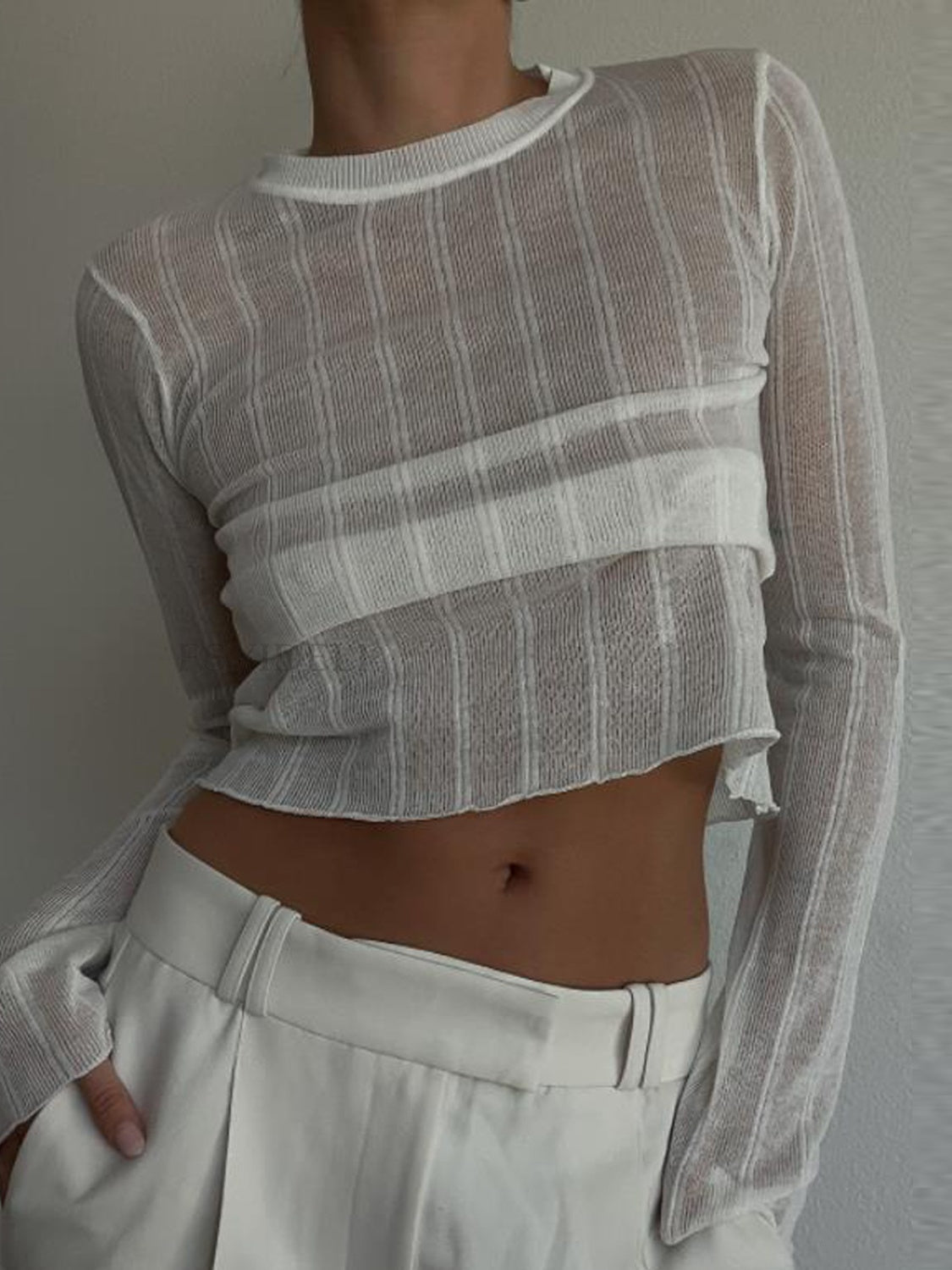 Round Neck Long Sleeve T-Shirt in sheer polyester, showcasing its stylish design and comfortable fit.