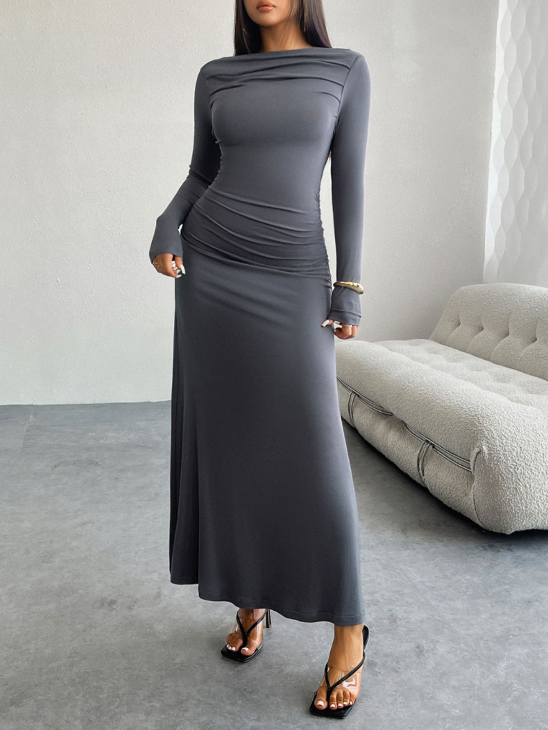A stylish Ruched Long Sleeve Maxi Dress in a flattering silhouette, showcasing its elegant design and soft fabric.