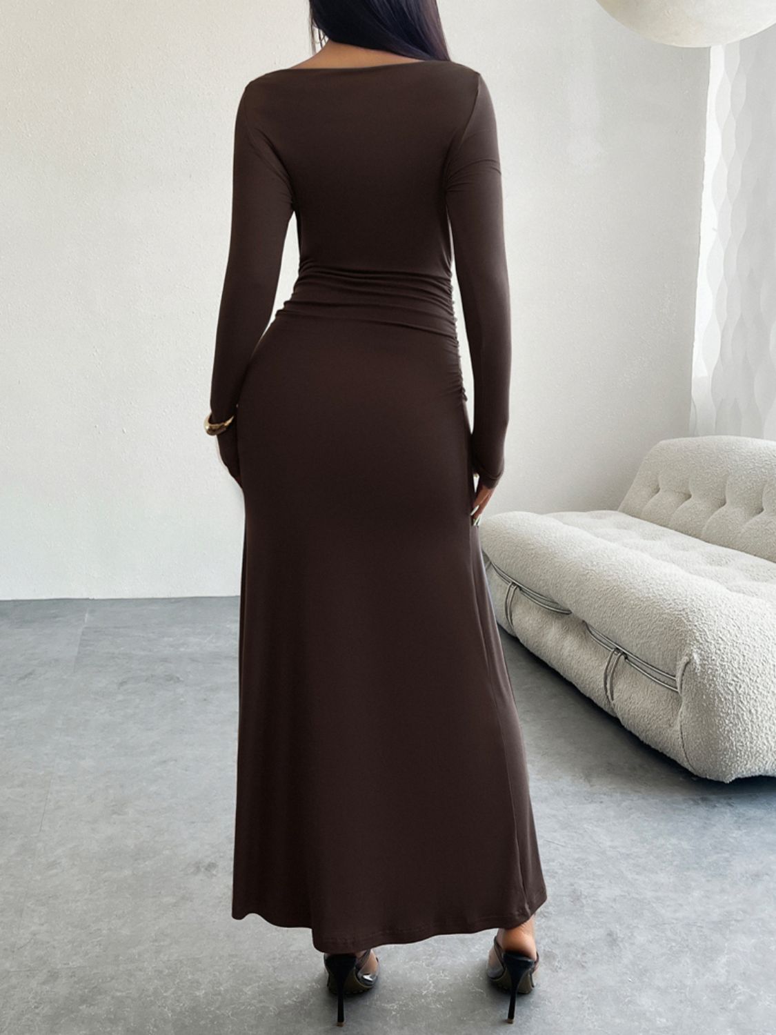 A stylish Ruched Long Sleeve Maxi Dress in a flattering silhouette, showcasing its elegant design and soft fabric.