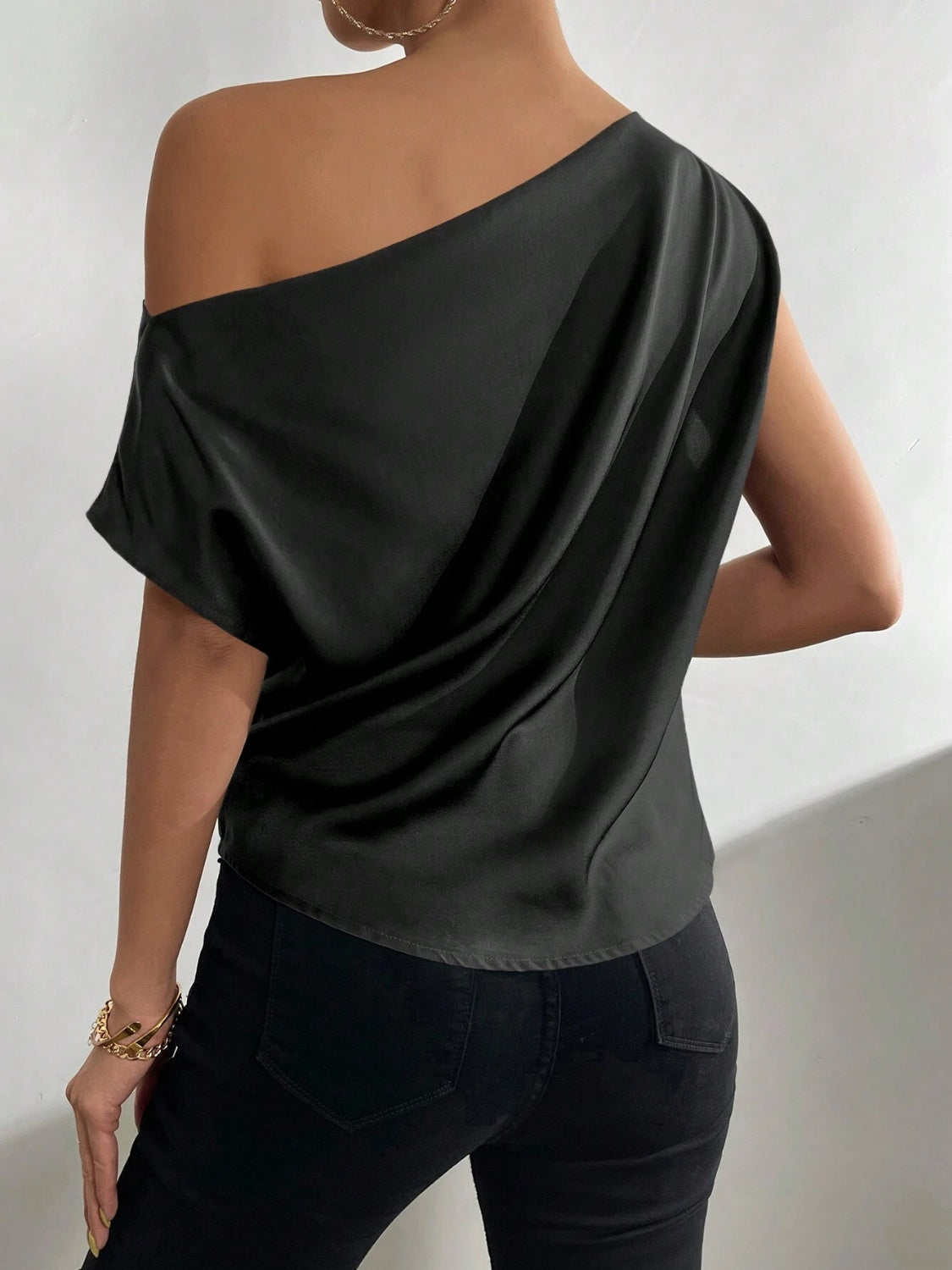 A stylish Ruched Single Shoulder Blouse in elegant design, showcasing its unique single shoulder style and soft fabric.