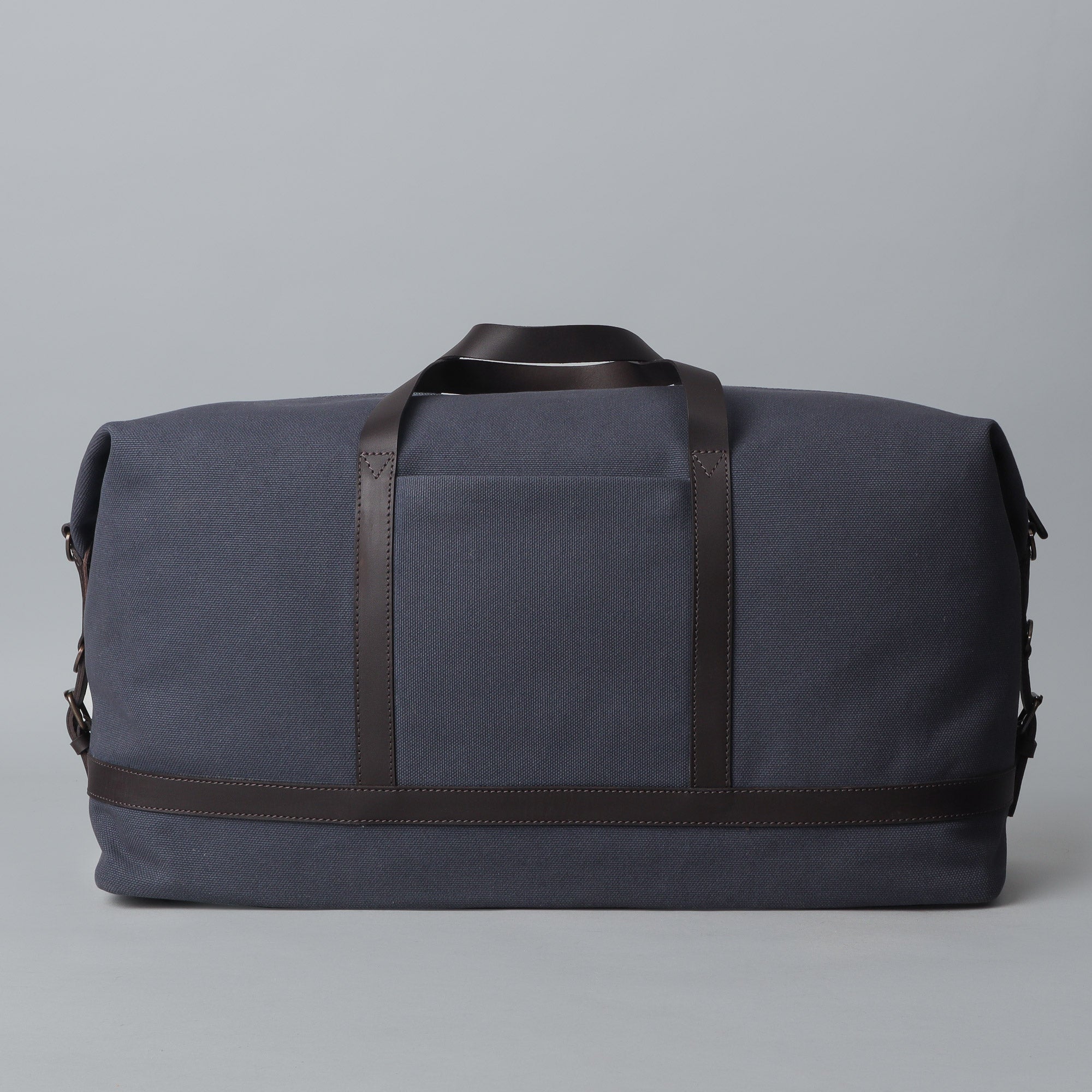 Runway Canvas Travel Bag featuring durable cotton canvas, adjustable leather strap, and vintage buckles.