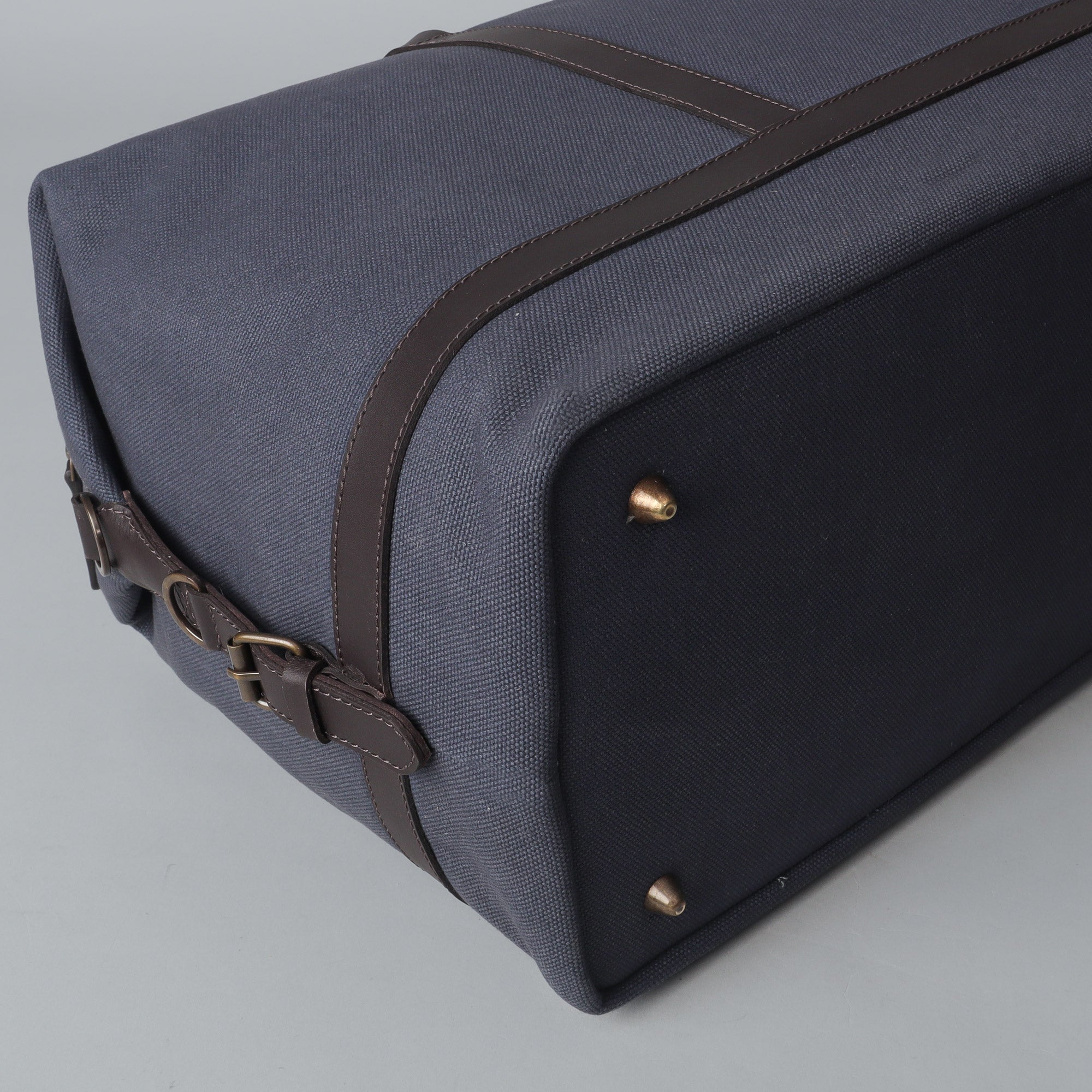 Runway Canvas Travel Bag featuring durable cotton canvas, adjustable leather strap, and vintage buckles.