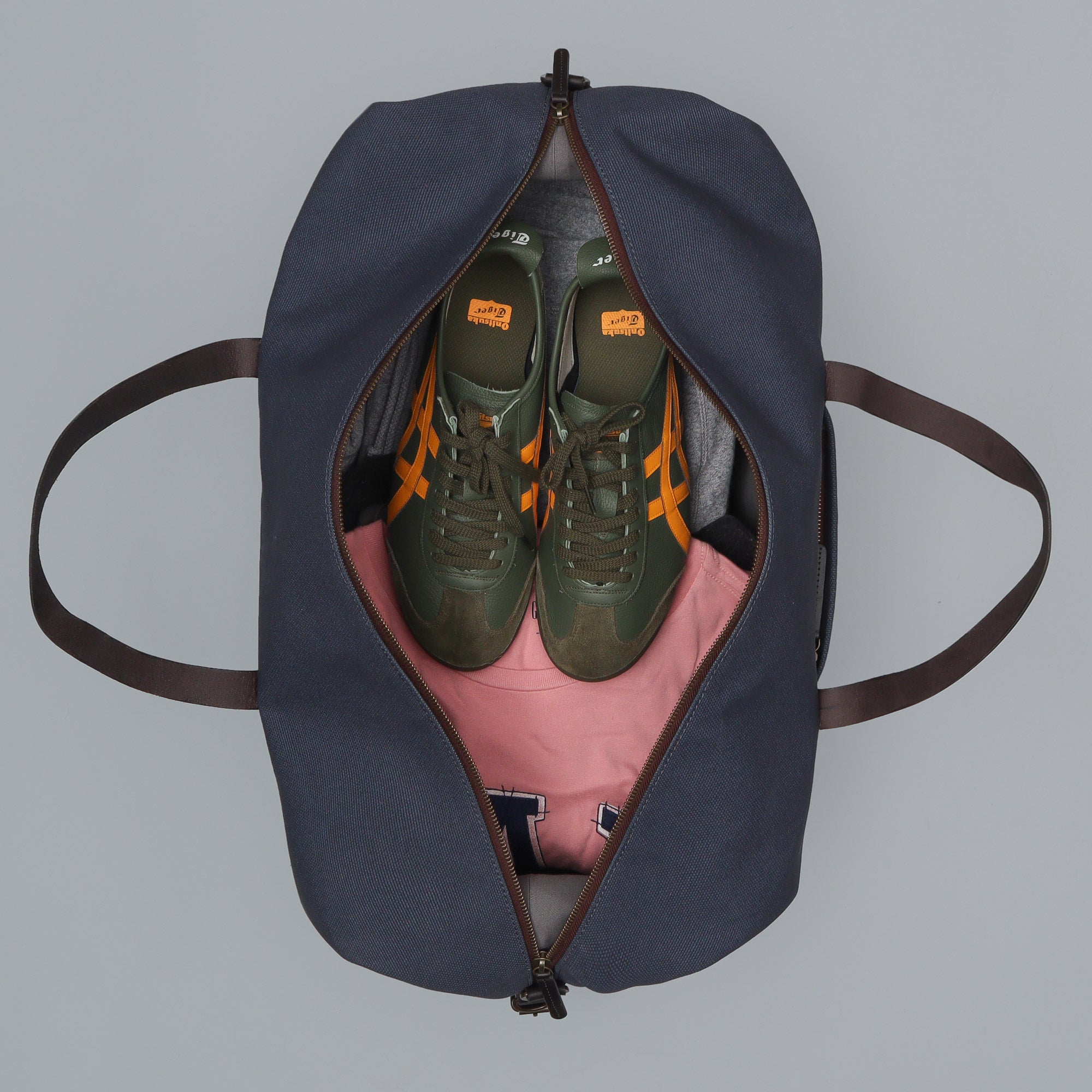 Runway Canvas Travel Bag featuring durable cotton canvas, adjustable leather strap, and vintage buckles.