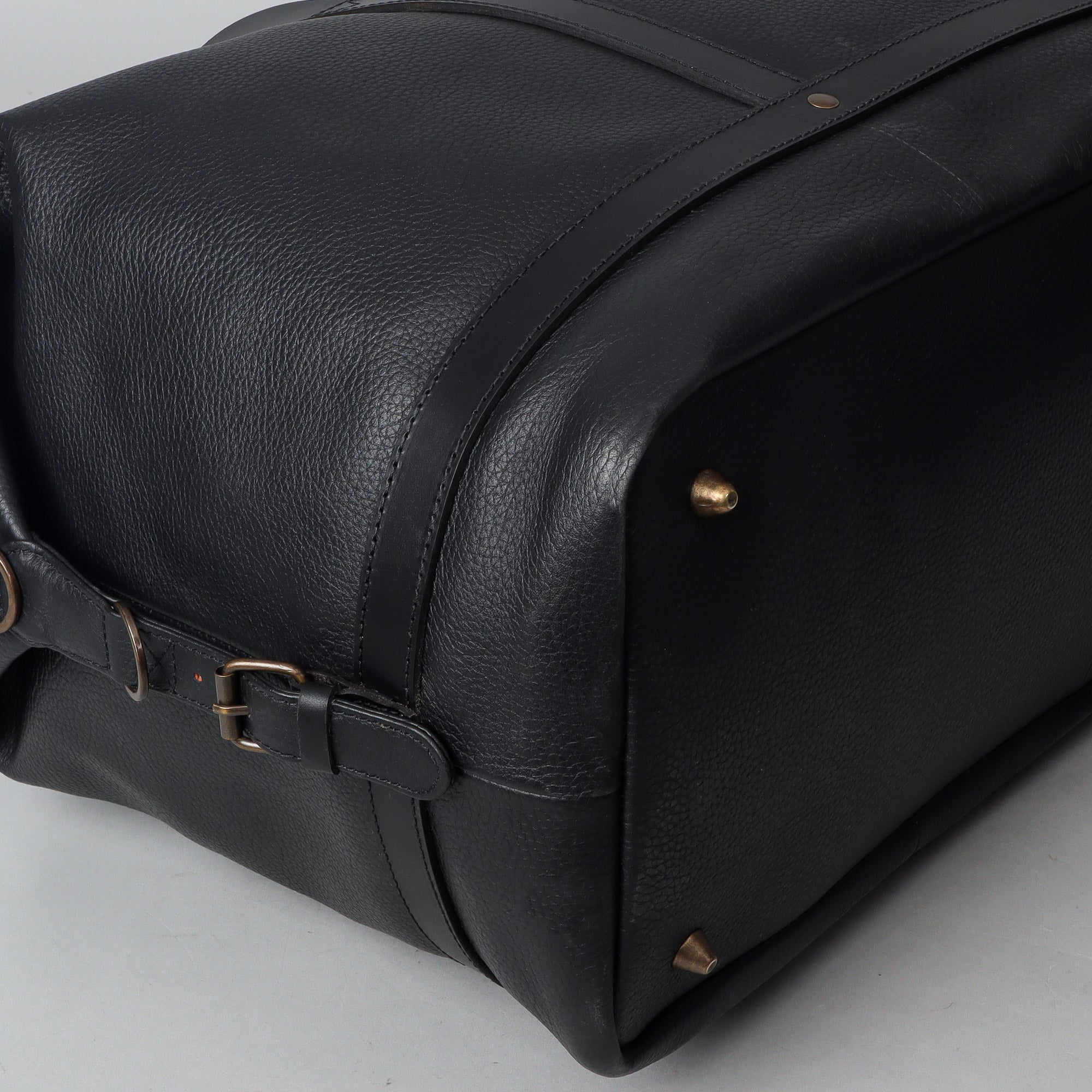 Runway Leather Travel Bag made from premium full grain leather with vintage buckles and adjustable strap, showcasing its spacious interior and elegant design.
