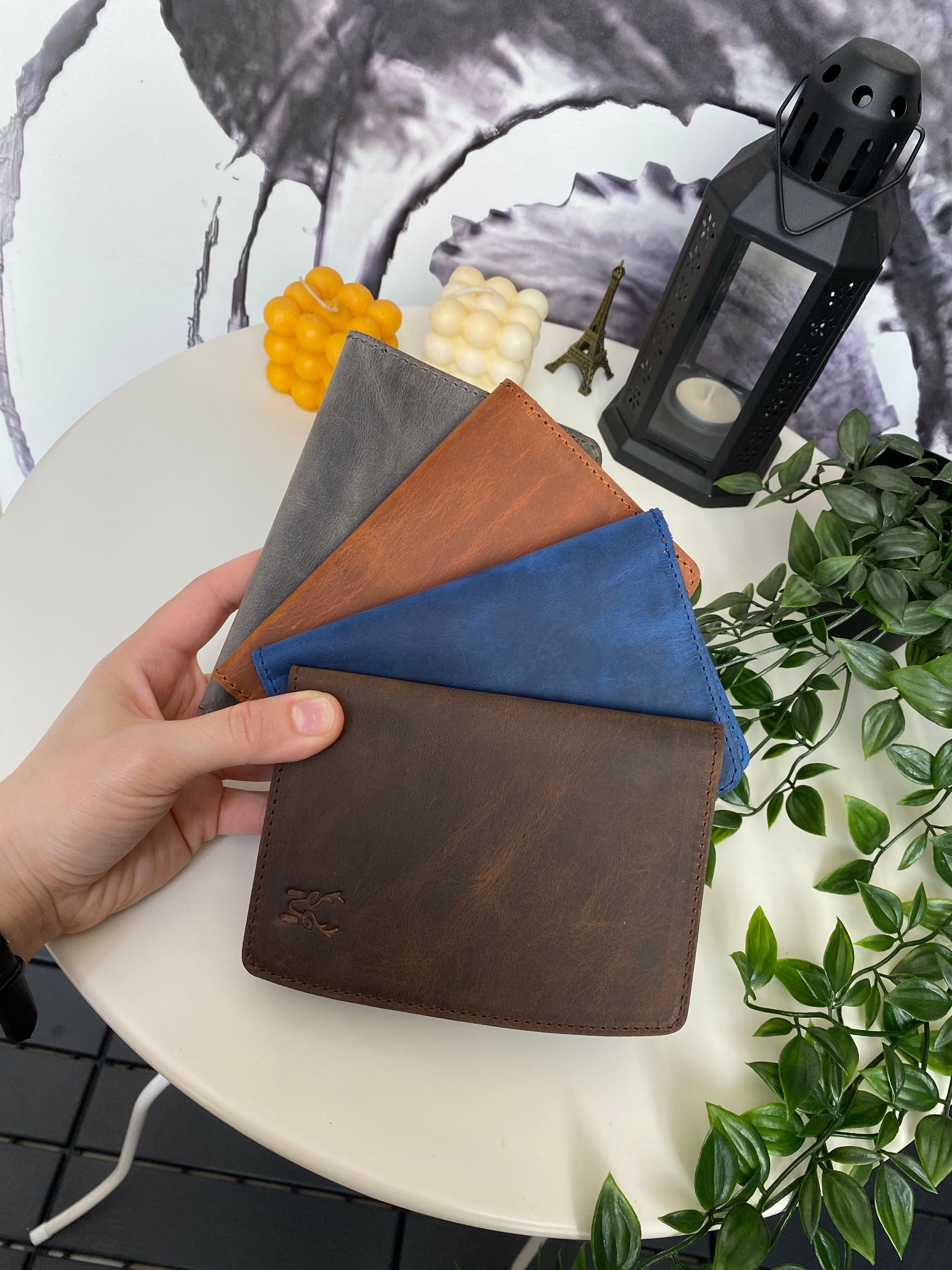 Simenit Genuine Leather Passport Holder in various colors, showcasing its elegant design and functionality.