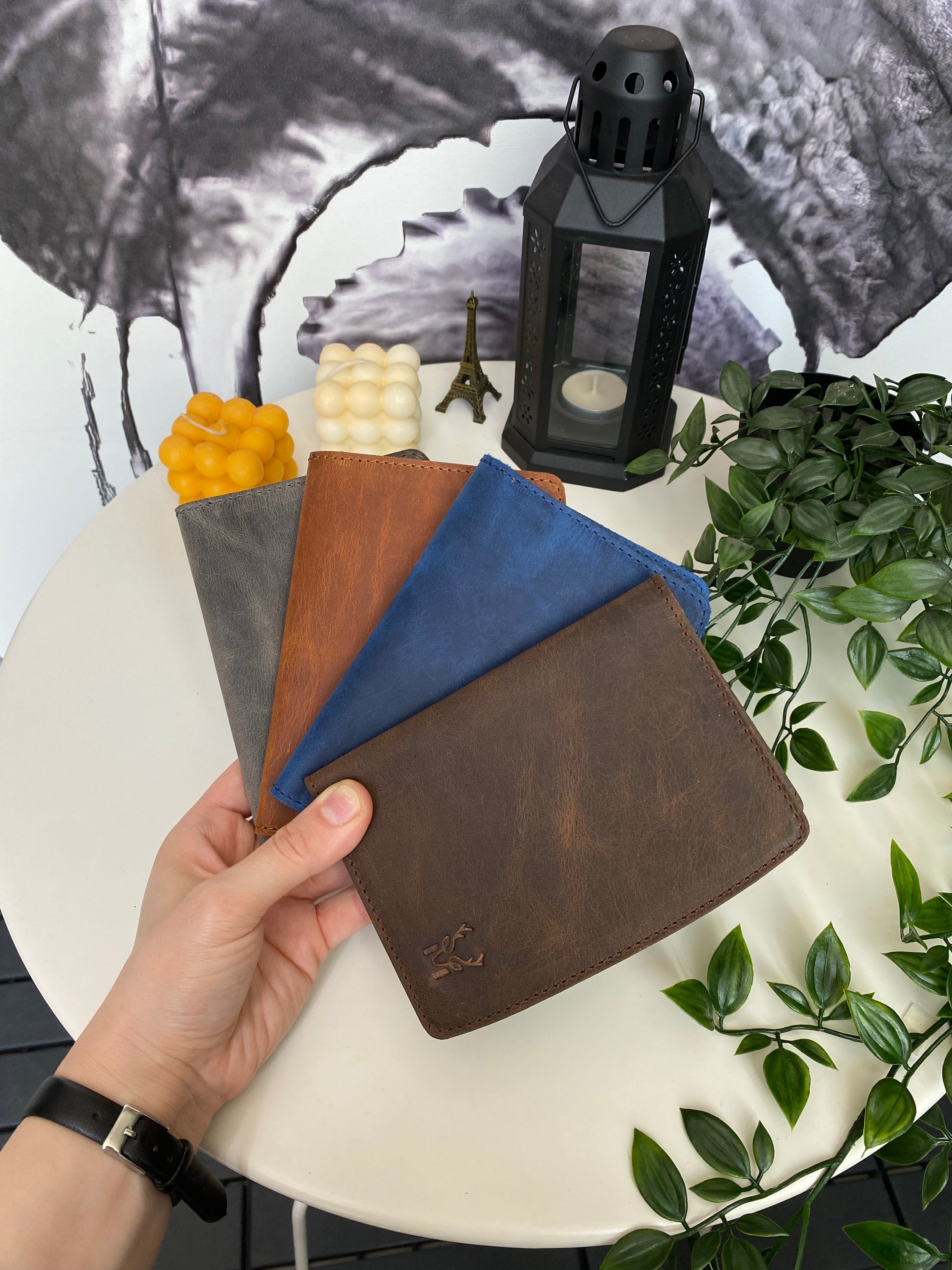 Simenit Genuine Leather Passport Holder in various colors, showcasing its elegant design and functionality.