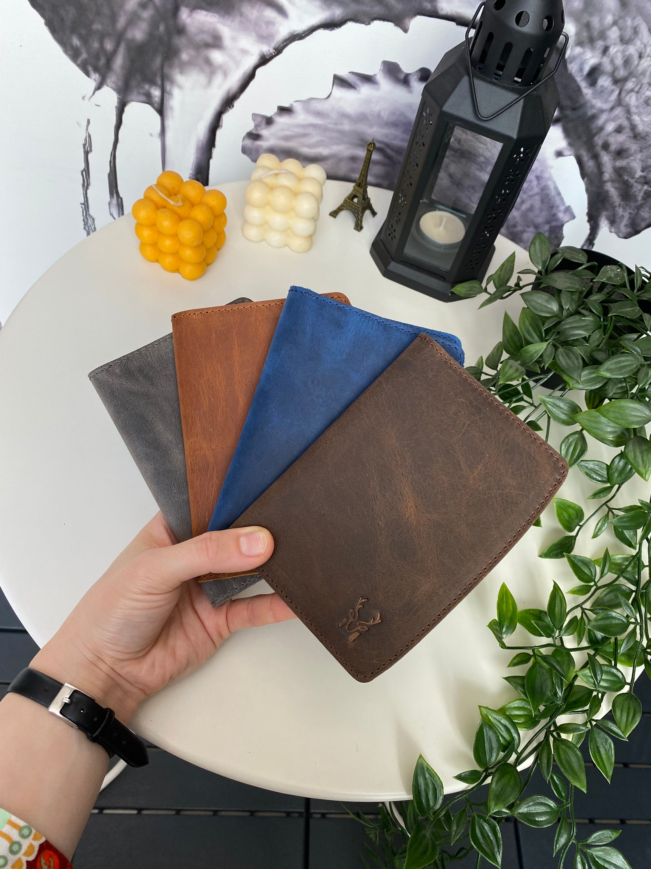 Simenit Genuine Leather Passport Holder in various colors, showcasing its elegant design and functionality.