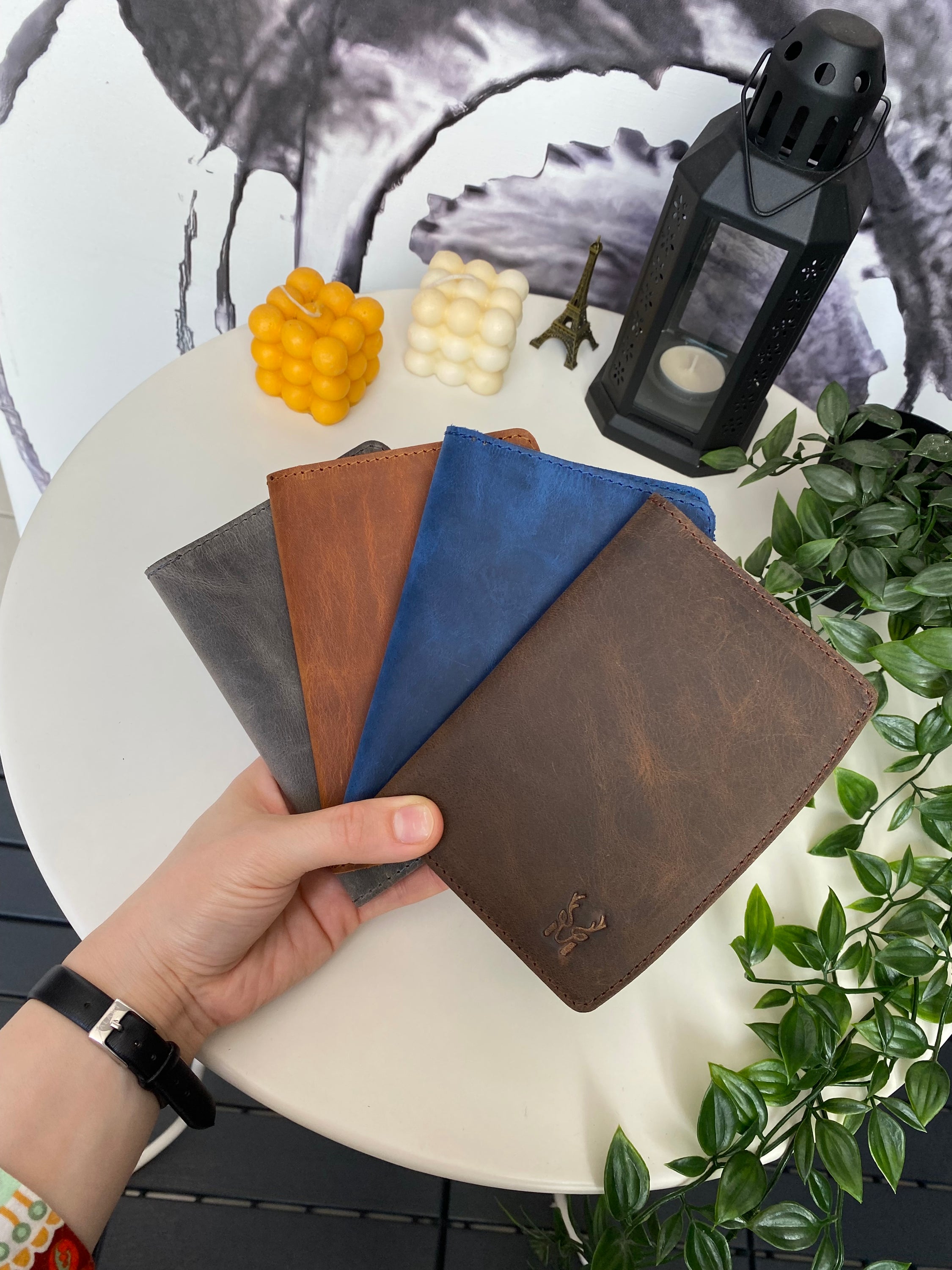 Simenit Genuine Leather Passport Holder in various colors, showcasing its elegant design and functionality.