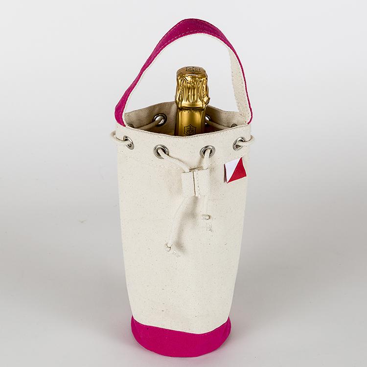 A sturdy canvas wine bag with a cinch top and colorful trim, designed to hold a single bottle of champagne or wine securely.