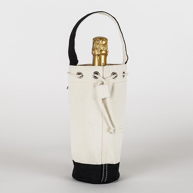 A sturdy canvas wine bag with a cinch top and colorful trim, designed to hold a single bottle of champagne or wine securely.