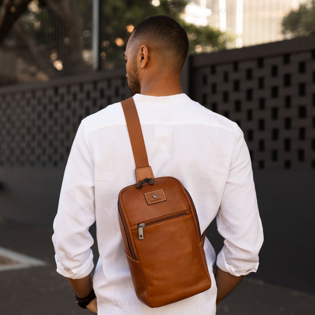 Colt Single Strap Backpack featuring multiple compartments and RFID security in a stylish design.