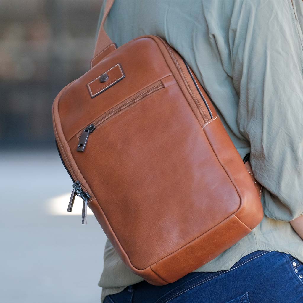 Colt Single Strap Backpack featuring multiple compartments and RFID security in a stylish design.