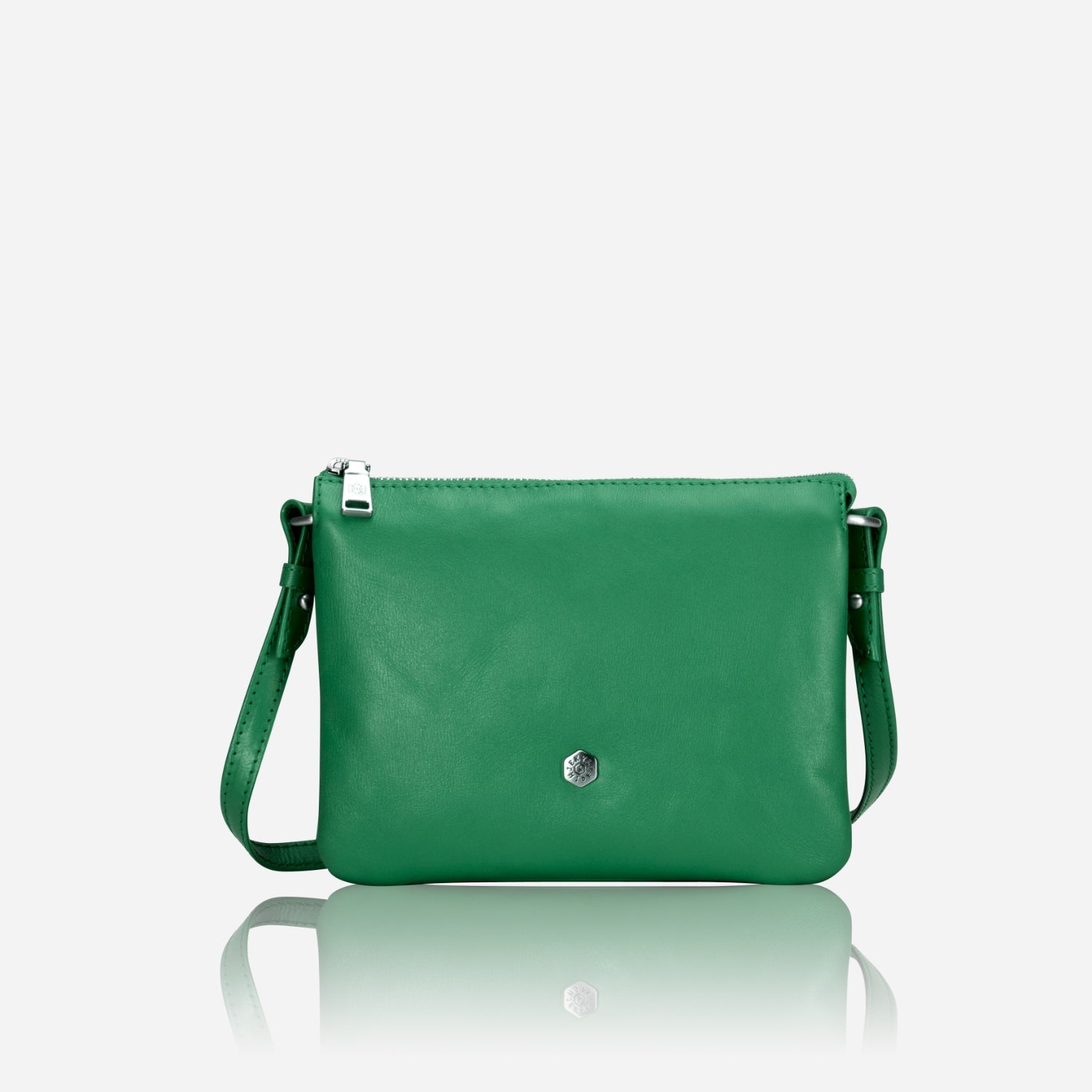 Slim Ladies Leather Crossbody handbag in Spring Basil color, showcasing its chic design and adjustable strap.