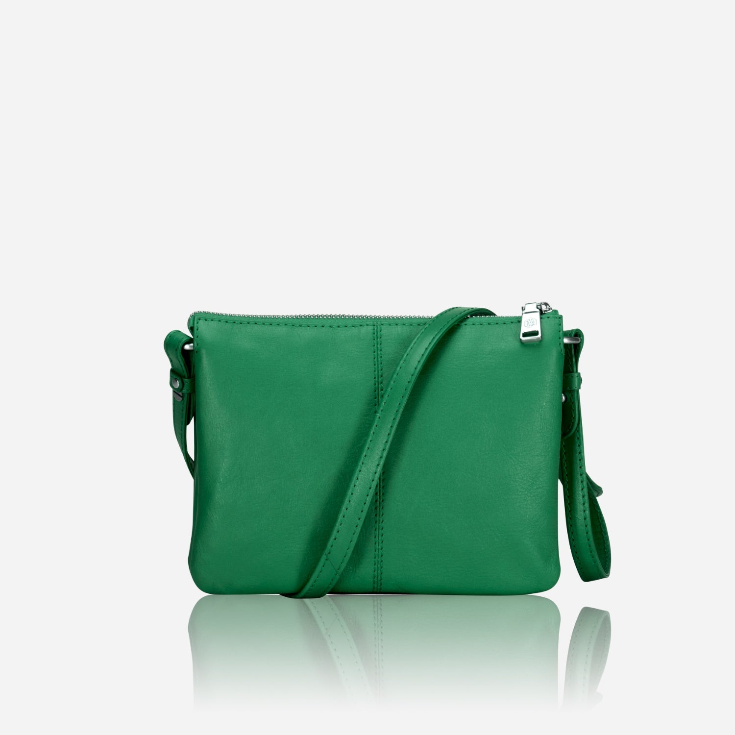 Slim Ladies Leather Crossbody handbag in Spring Basil color, showcasing its chic design and adjustable strap.