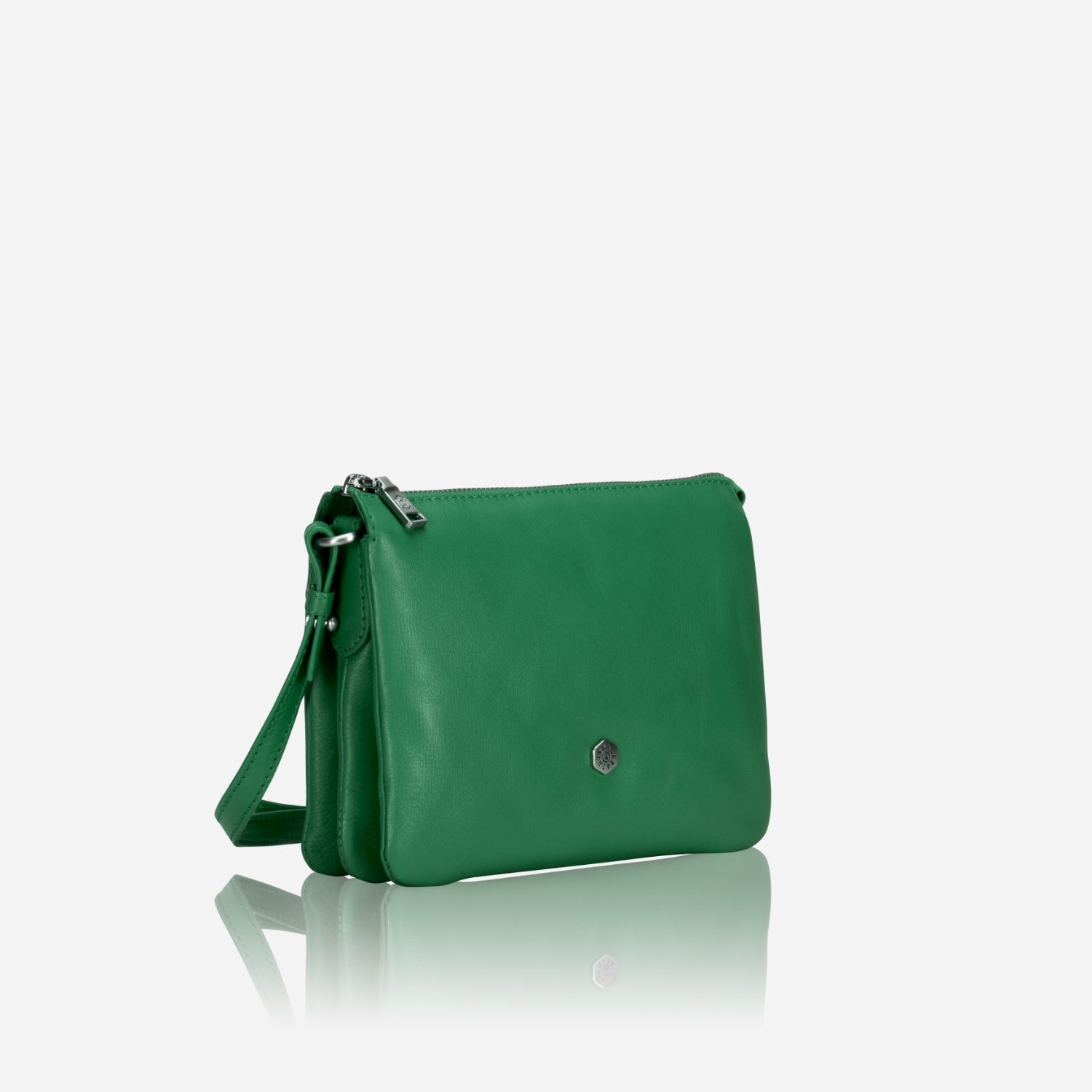 Slim Ladies Leather Crossbody handbag in Spring Basil color, showcasing its chic design and adjustable strap.
