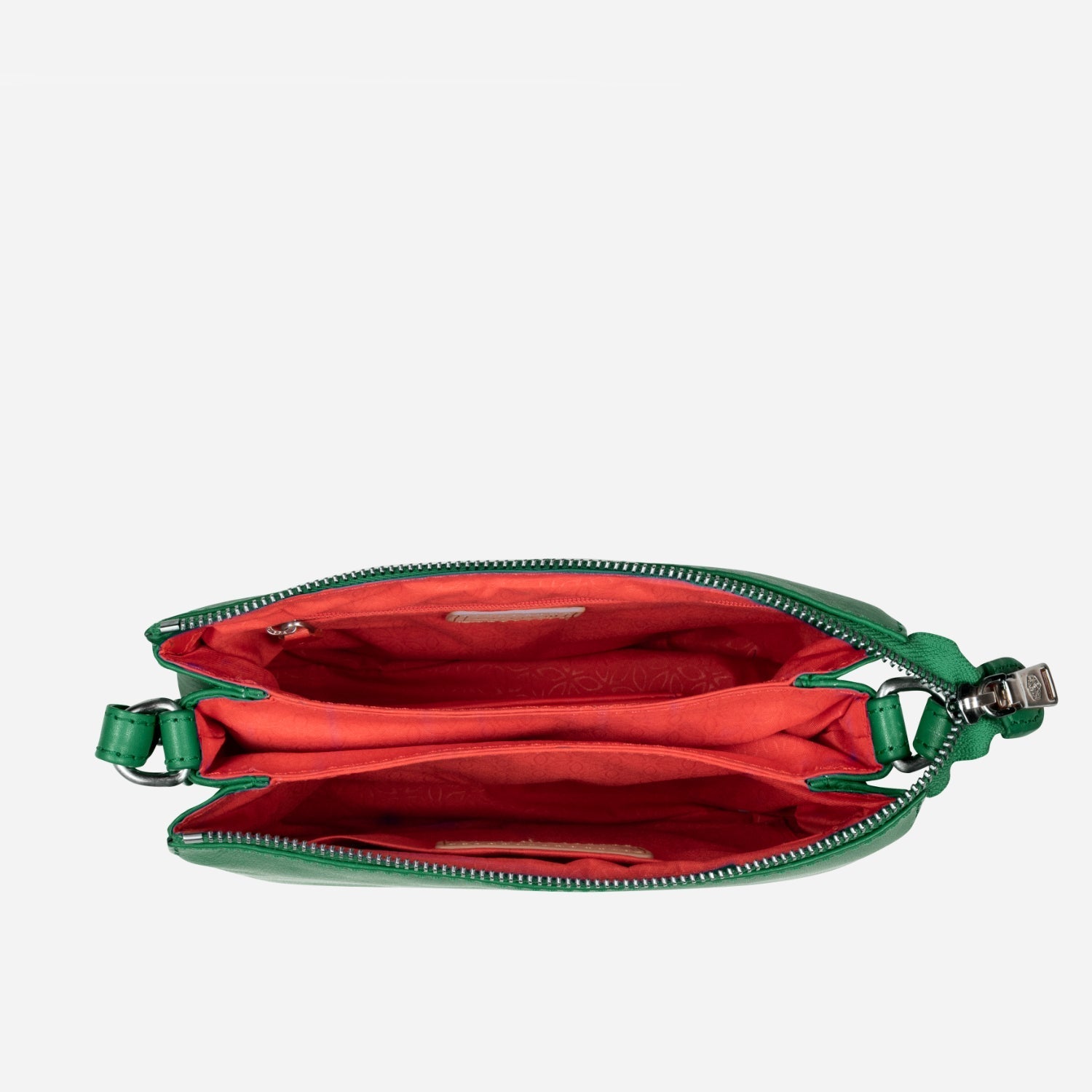 Slim Ladies Leather Crossbody handbag in Spring Basil color, showcasing its chic design and adjustable strap.