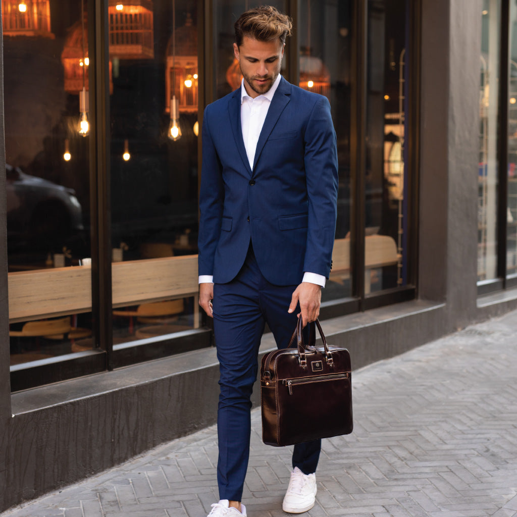 Slim Zip Top Briefcase in Tobacco leather, showcasing its elegant design and spacious zippered compartment.