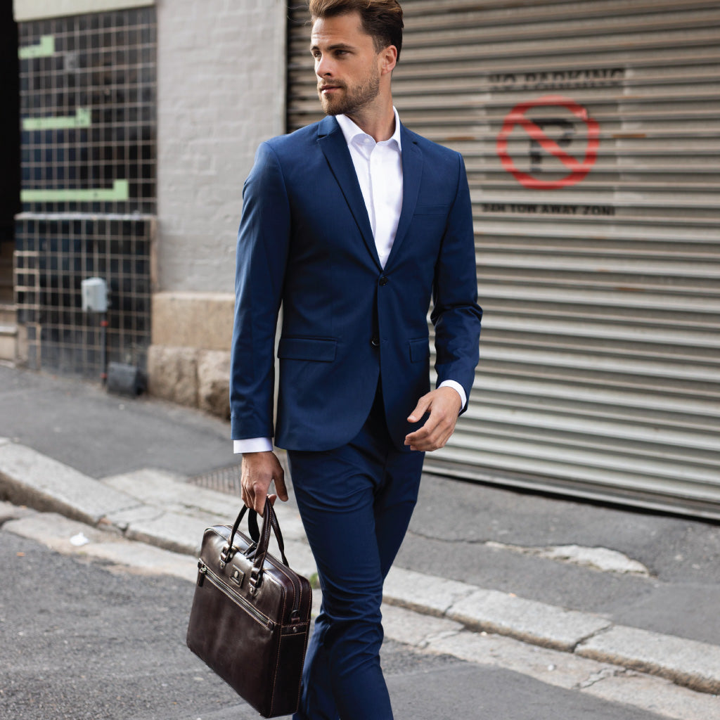 Slim Zip Top Briefcase in Tobacco leather, showcasing its elegant design and spacious zippered compartment.