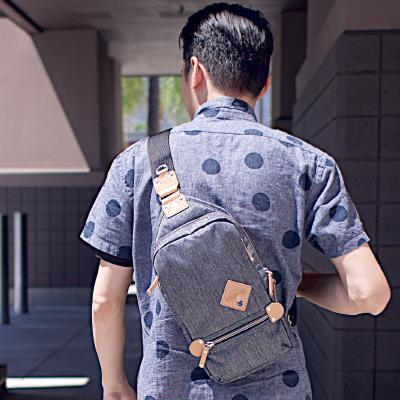SLING PACK ELEMENT in three colors, showcasing its sleek design and multiple pockets.