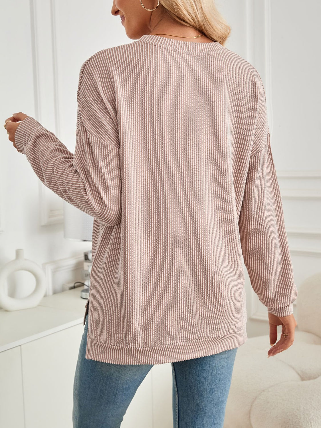 A stylish Slit Round Neck Long Sleeve Sweatshirt featuring a modern slit design, made from a soft and stretchy fabric blend.