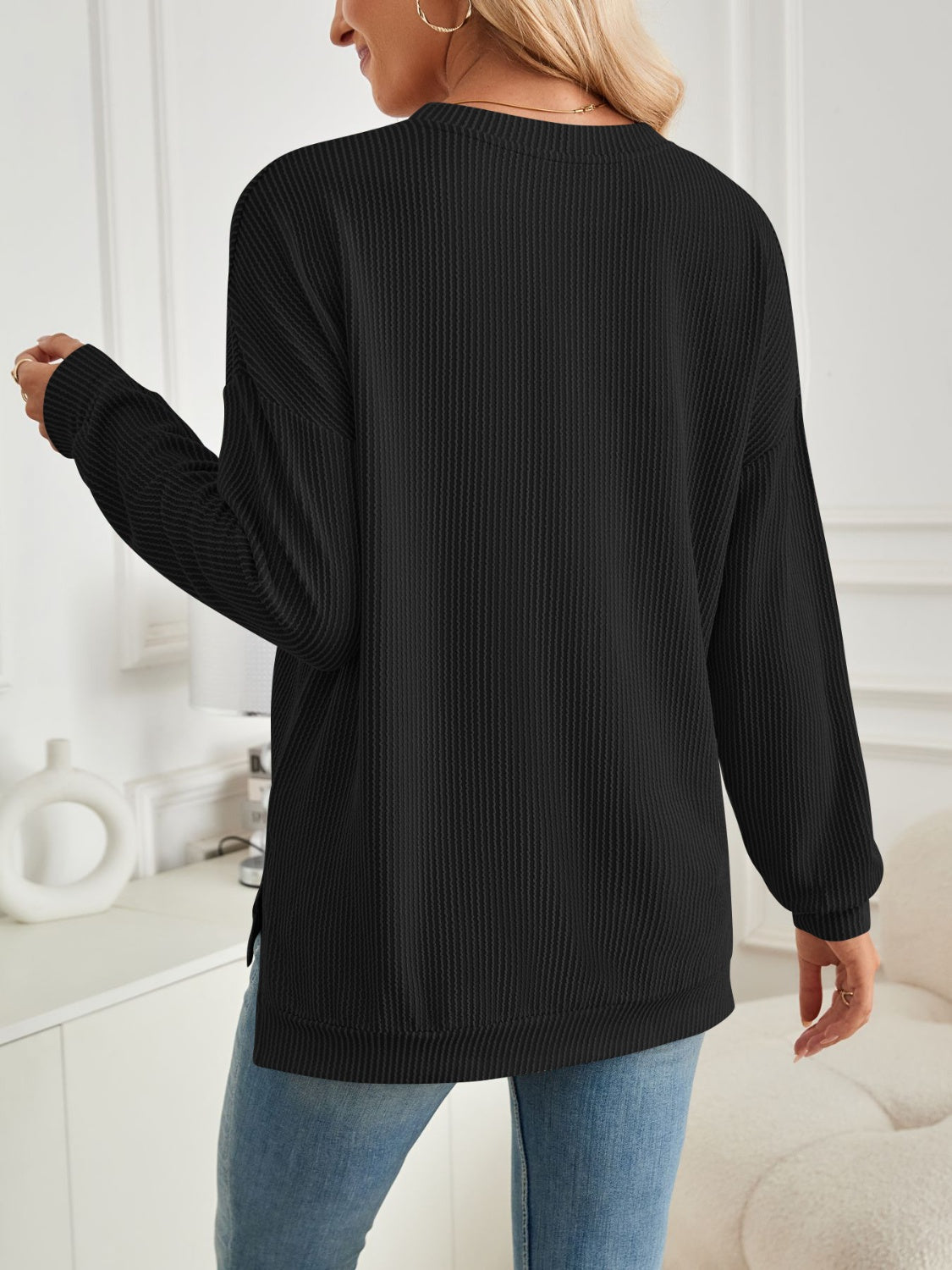 A stylish Slit Round Neck Long Sleeve Sweatshirt featuring a modern slit design, made from a soft and stretchy fabric blend.