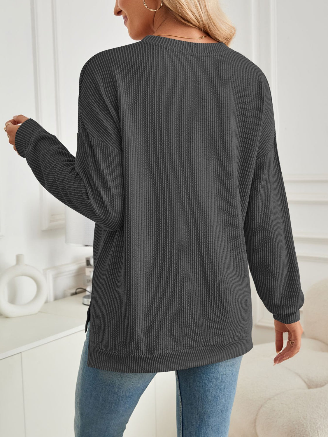 A stylish Slit Round Neck Long Sleeve Sweatshirt featuring a modern slit design, made from a soft and stretchy fabric blend.
