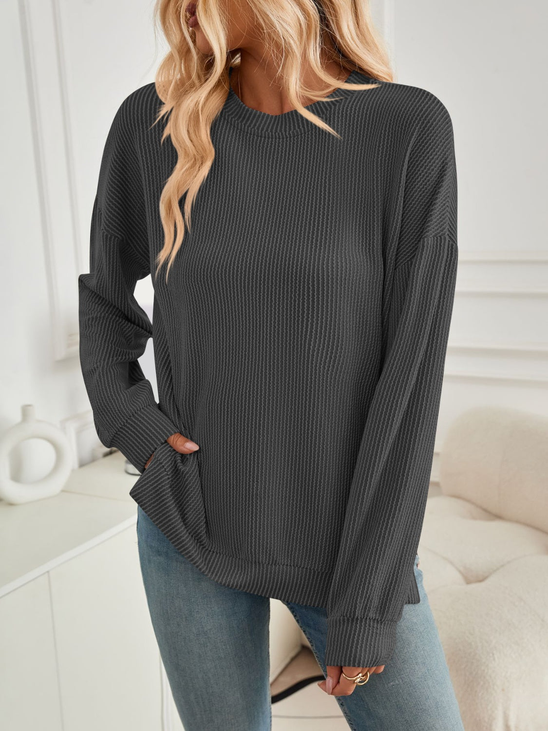 A stylish Slit Round Neck Long Sleeve Sweatshirt featuring a modern slit design, made from a soft and stretchy fabric blend.