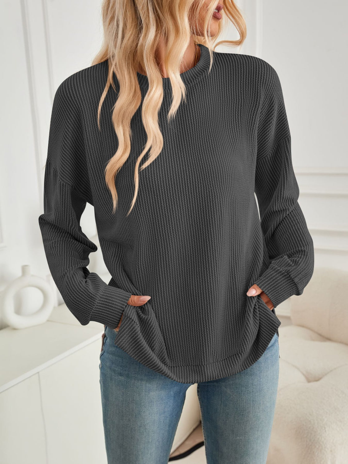 A stylish Slit Round Neck Long Sleeve Sweatshirt featuring a modern slit design, made from a soft and stretchy fabric blend.