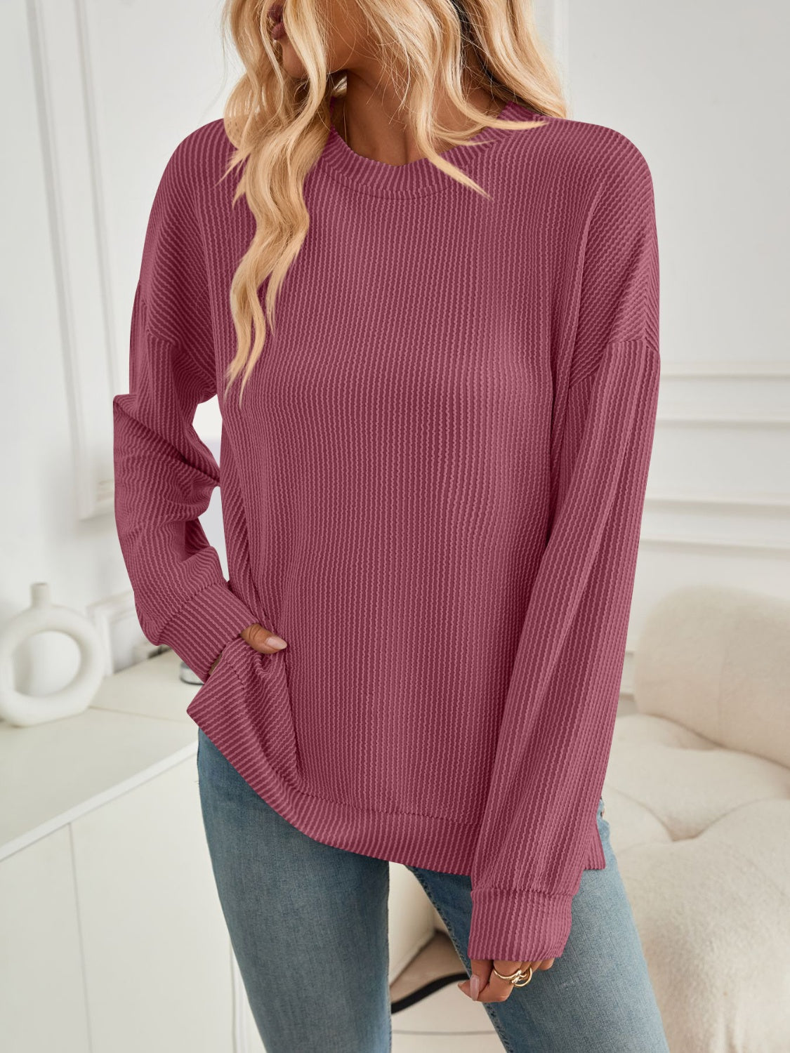 A stylish Slit Round Neck Long Sleeve Sweatshirt featuring a modern slit design, made from a soft and stretchy fabric blend.