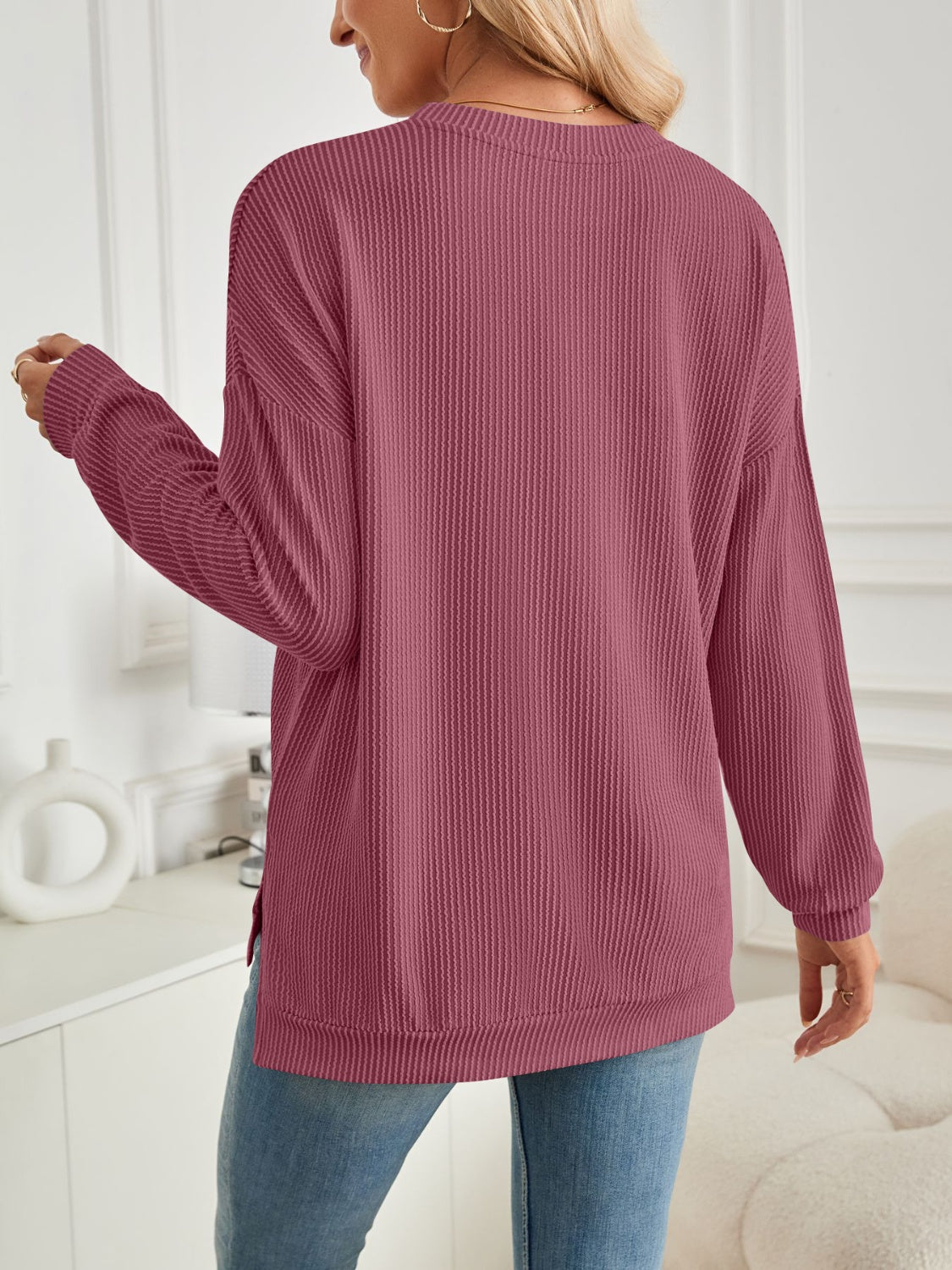 A stylish Slit Round Neck Long Sleeve Sweatshirt featuring a modern slit design, made from a soft and stretchy fabric blend.