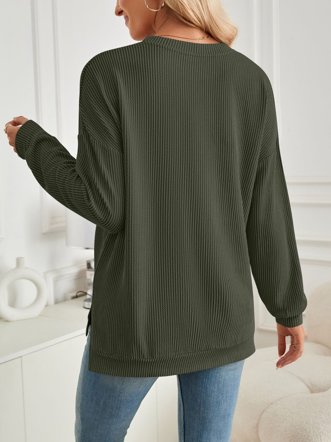 A stylish Slit Round Neck Long Sleeve Sweatshirt featuring a modern slit design, made from a soft and stretchy fabric blend.