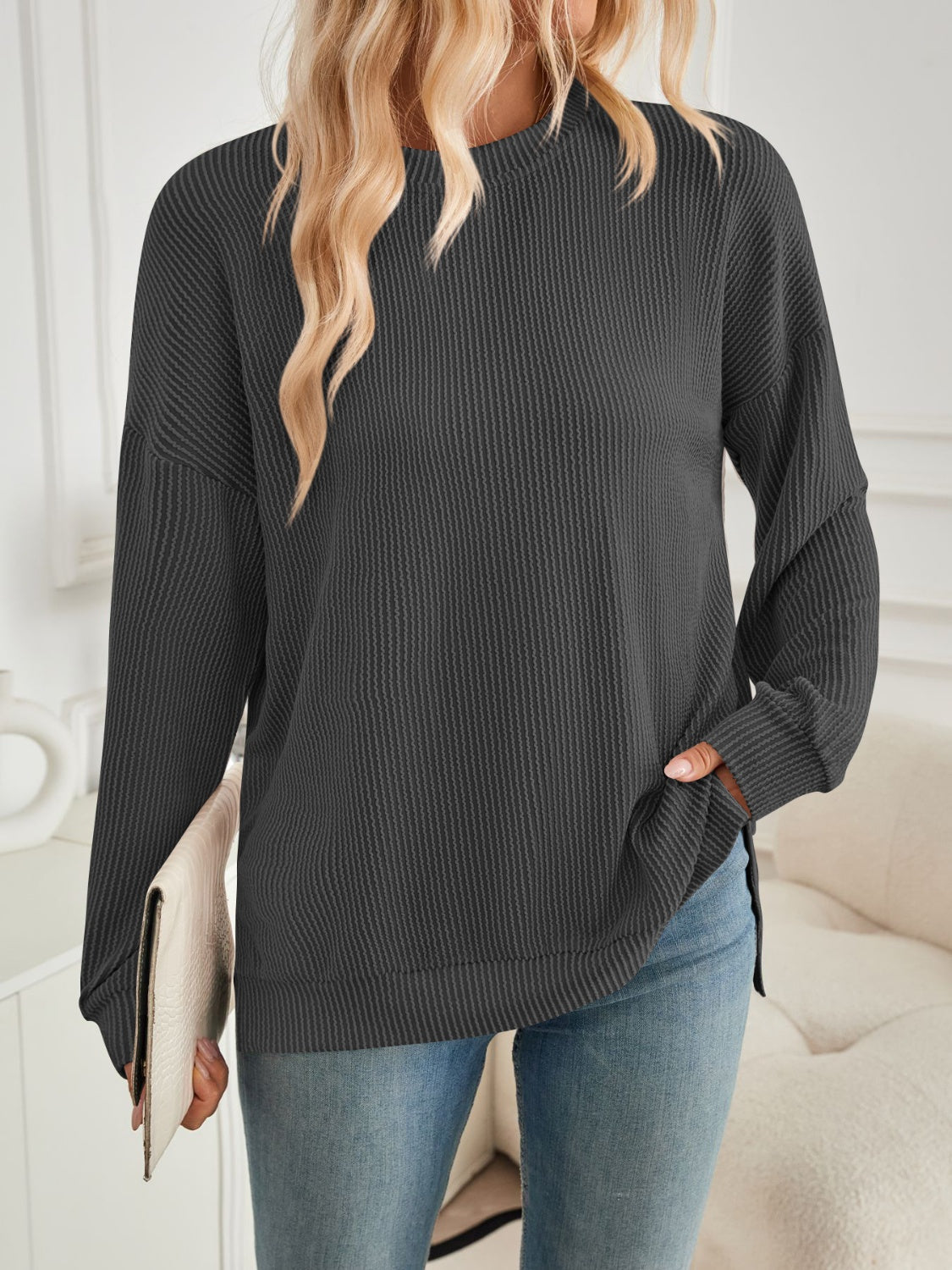 A stylish Slit Round Neck Long Sleeve Sweatshirt featuring a modern slit design, made from a soft and stretchy fabric blend.