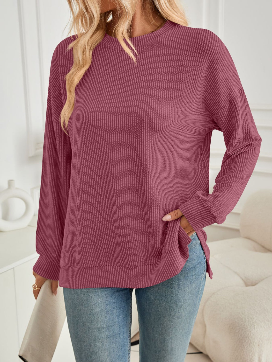 A stylish Slit Round Neck Long Sleeve Sweatshirt featuring a modern slit design, made from a soft and stretchy fabric blend.