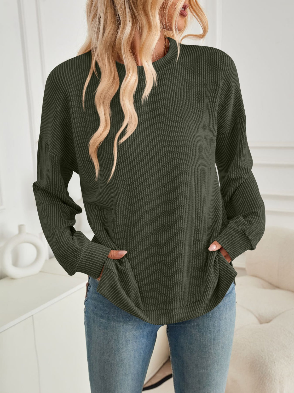 A stylish Slit Round Neck Long Sleeve Sweatshirt featuring a modern slit design, made from a soft and stretchy fabric blend.