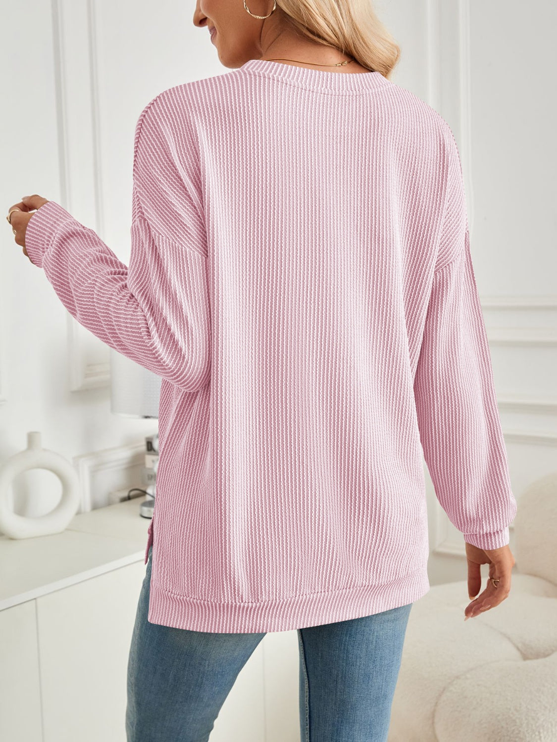 A stylish Slit Round Neck Long Sleeve Sweatshirt featuring a modern slit design, made from a soft and stretchy fabric blend.