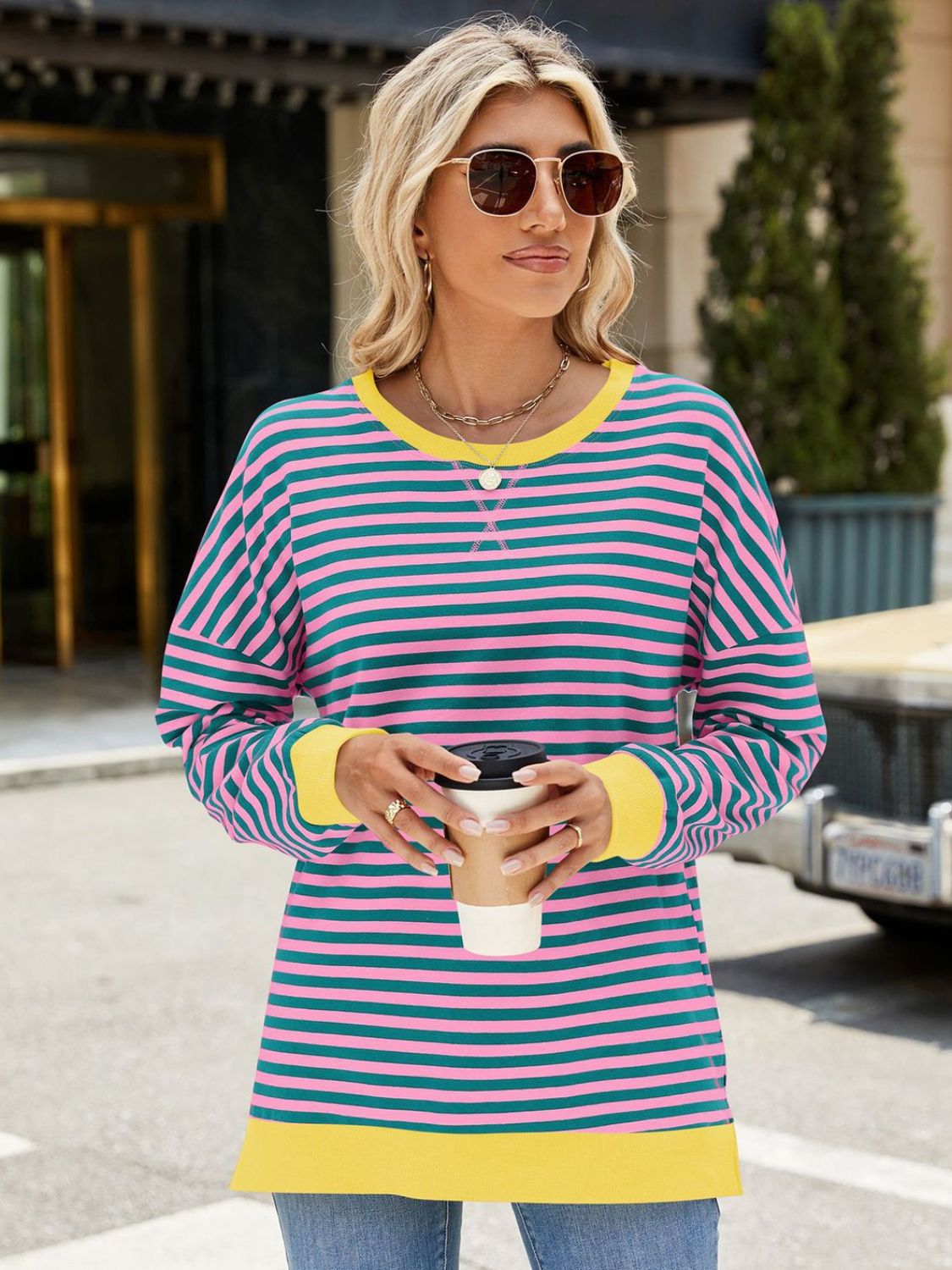 A stylish Slit Striped Round Neck Long Sleeve Sweatshirt featuring a trendy slit design, soft fabric, and available in various sizes.