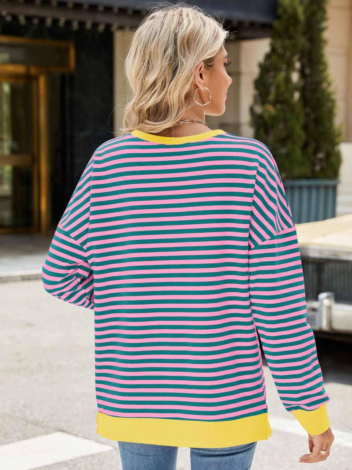 A stylish Slit Striped Round Neck Long Sleeve Sweatshirt featuring a trendy slit design, soft fabric, and available in various sizes.