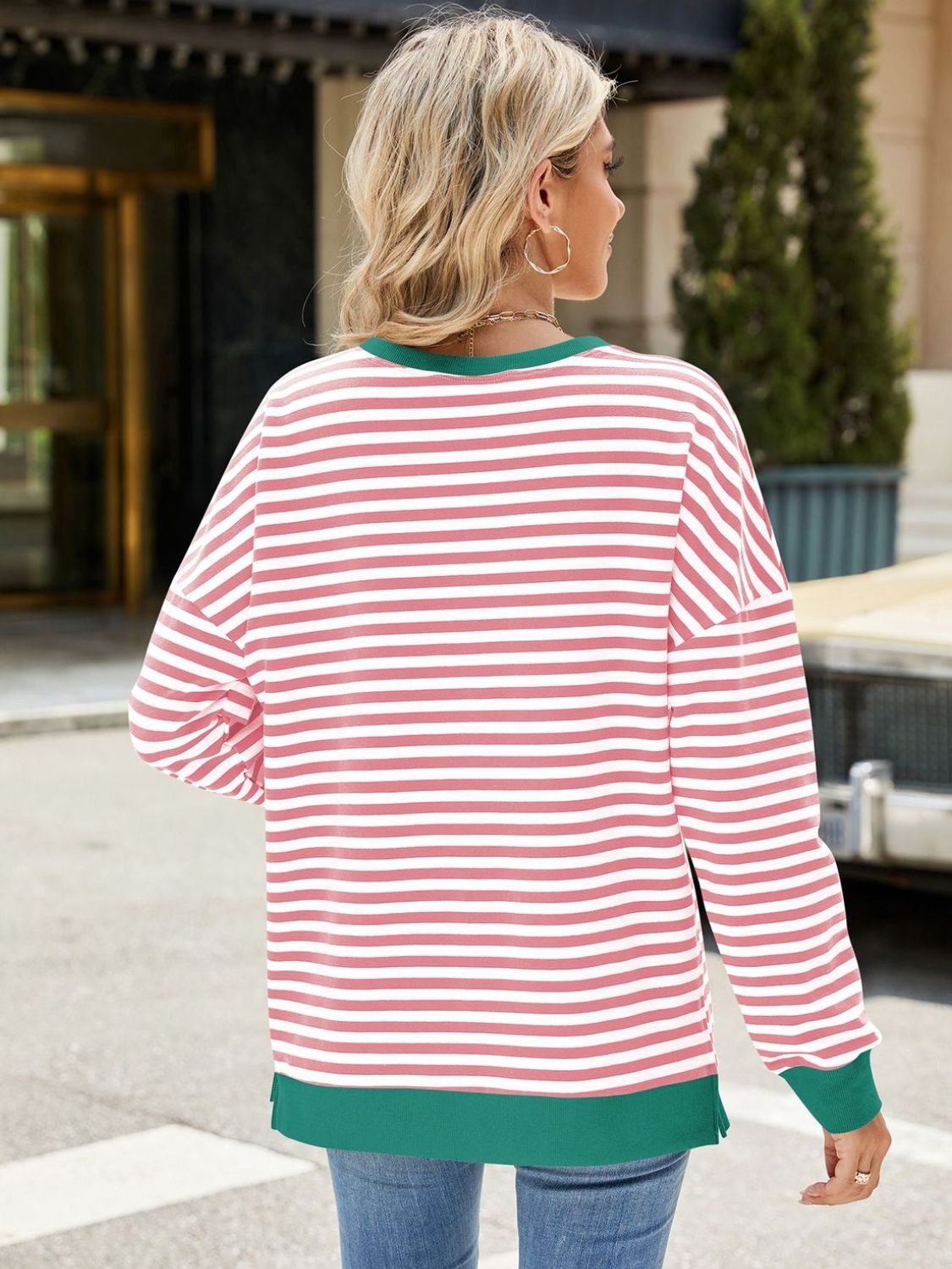 A stylish Slit Striped Round Neck Long Sleeve Sweatshirt featuring a trendy slit design, soft fabric, and available in various sizes.