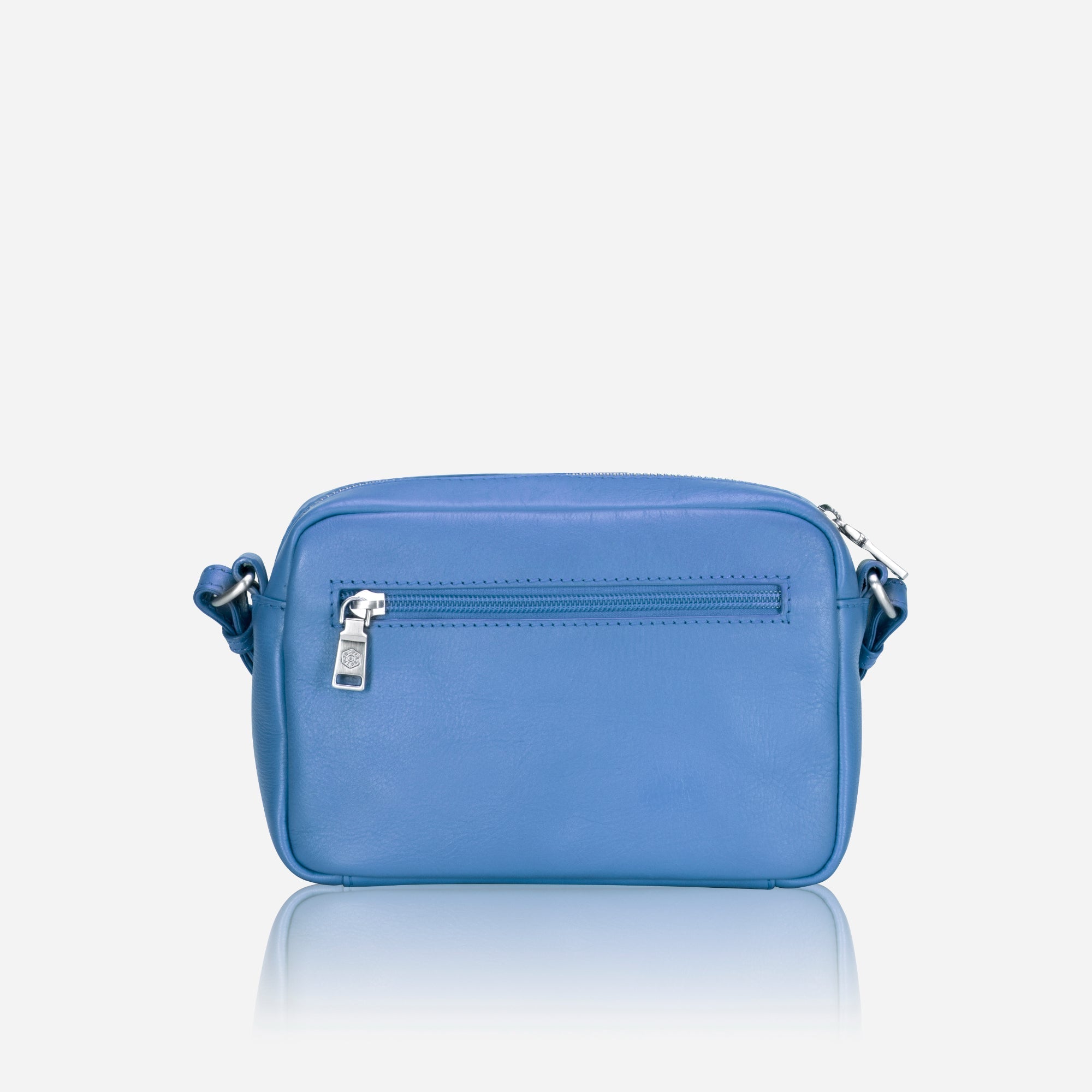 Small Crossbody bag in Sea Glass color with vibrant lining, showcasing its sleek design and spacious interior.