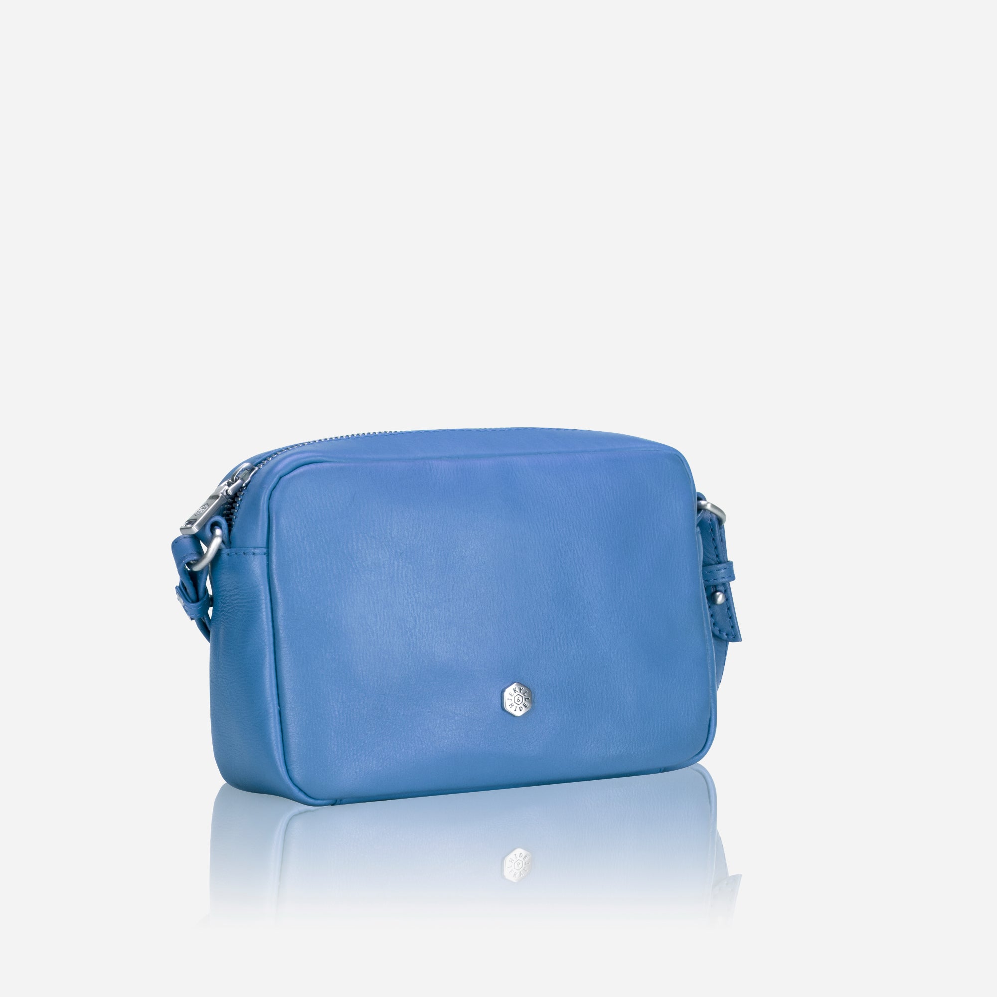Small Crossbody bag in Sea Glass color with vibrant lining, showcasing its sleek design and spacious interior.