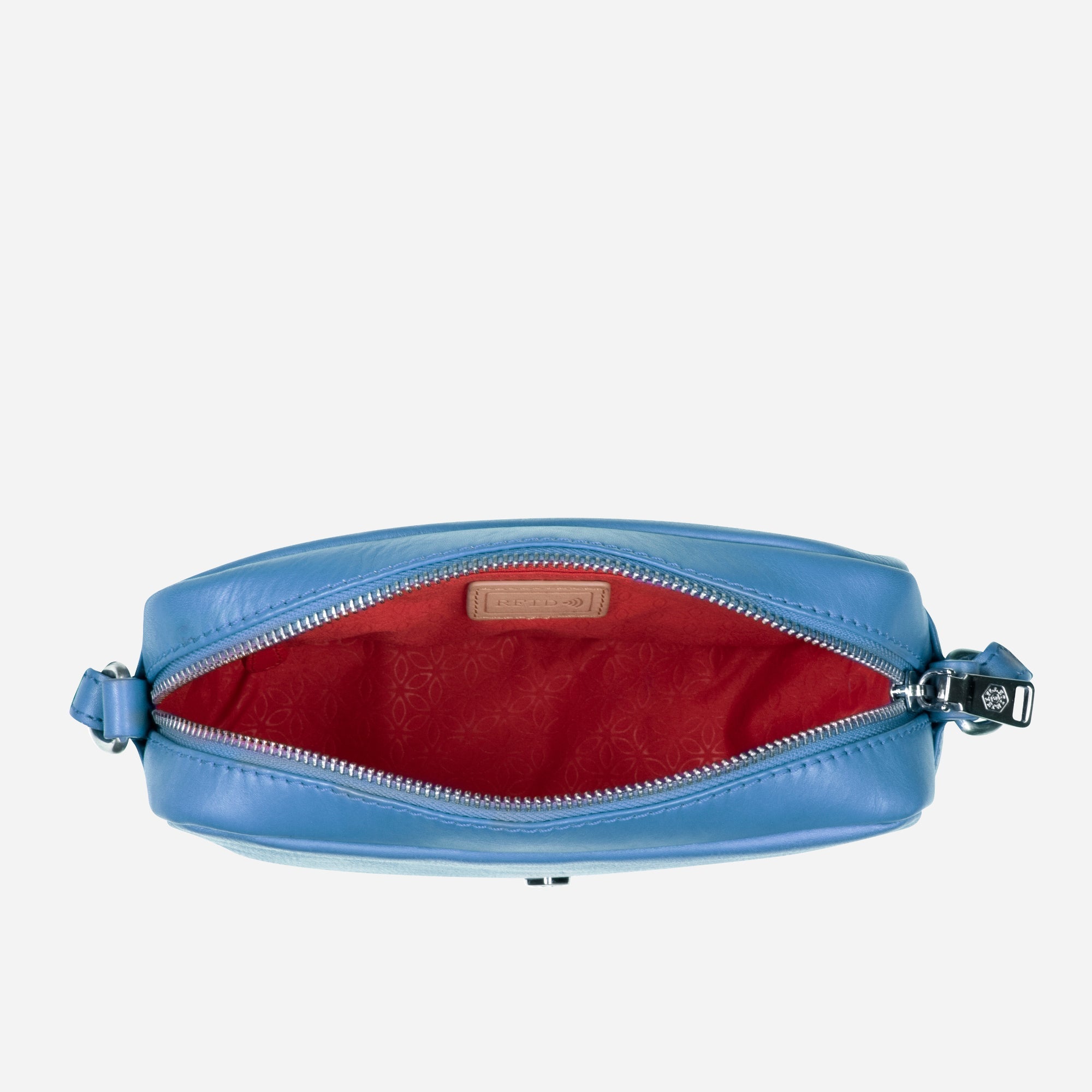 Small Crossbody bag in Sea Glass color with vibrant lining, showcasing its sleek design and spacious interior.